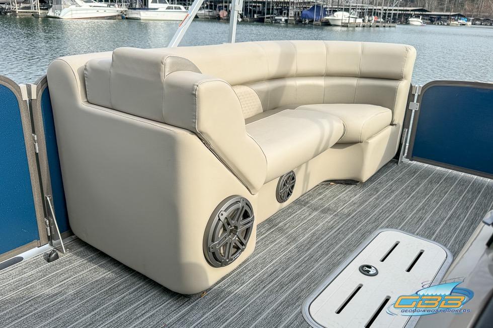 2021 Premier 230 Sunsation RL PTX boat interior with beige seating and speaker system.