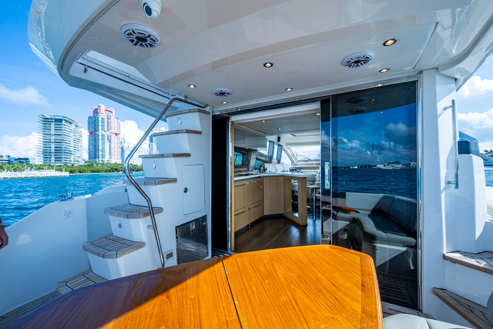 Luxurious 2018 Sea Ray L550 Fly yacht interior with ocean view and modern amenities.