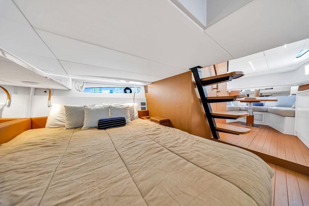 Luxurious interior of 2021 Bluegame BG 42 yacht with cozy bedroom and modern design.