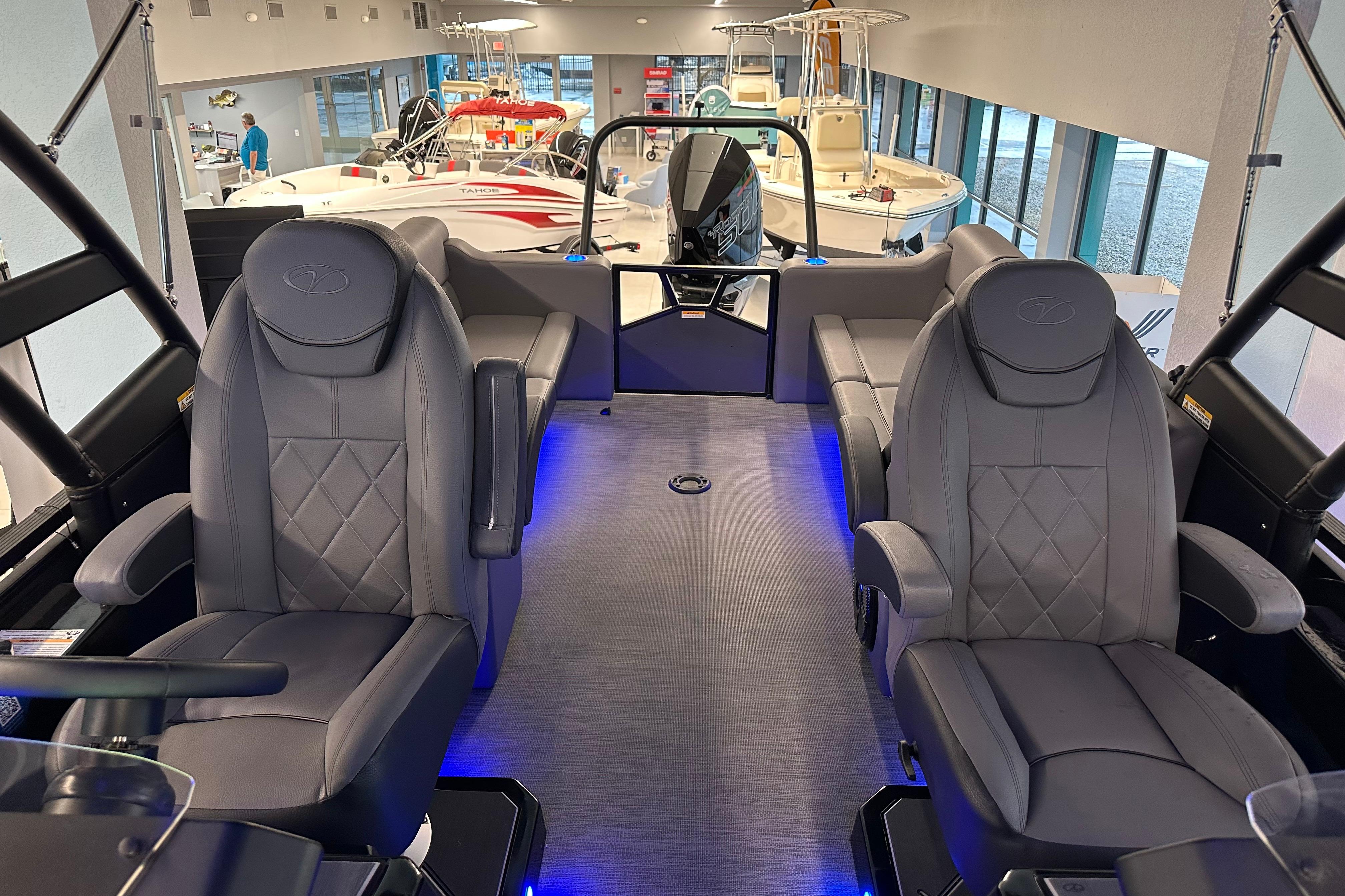Interior of 2025 Veranda VX 27 DCRC boat with luxurious seating and ambient lighting.