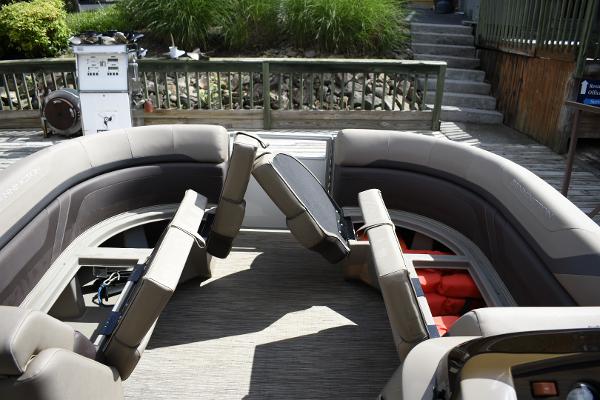 2023 Bennington 22 SXCW boat interior with seating and storage compartments.