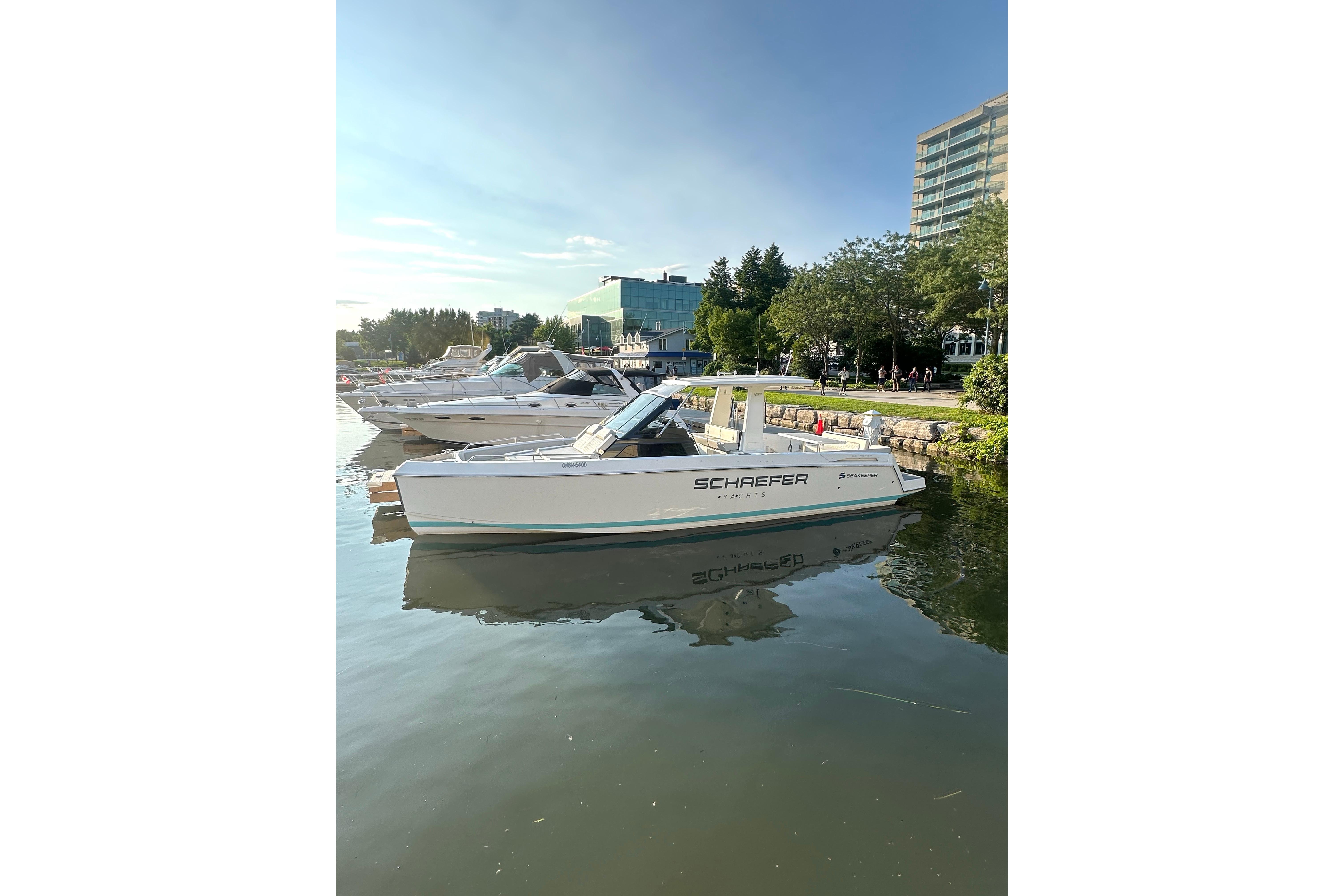 2022 Schaefer V33 yacht docked in a serene marina setting.