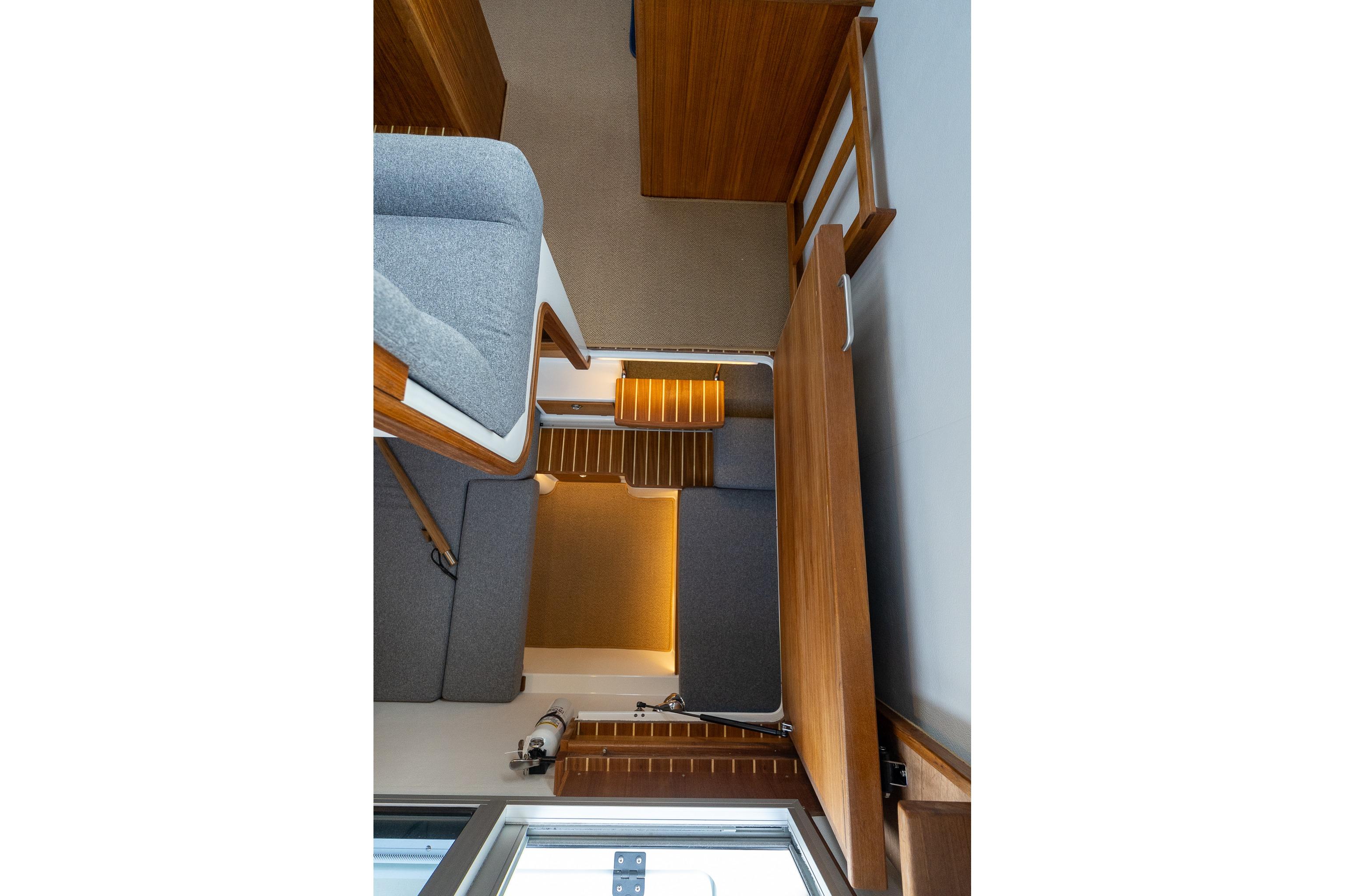 Interior of 2026 Targa 27.2 boat with wooden and gray fabric design.
