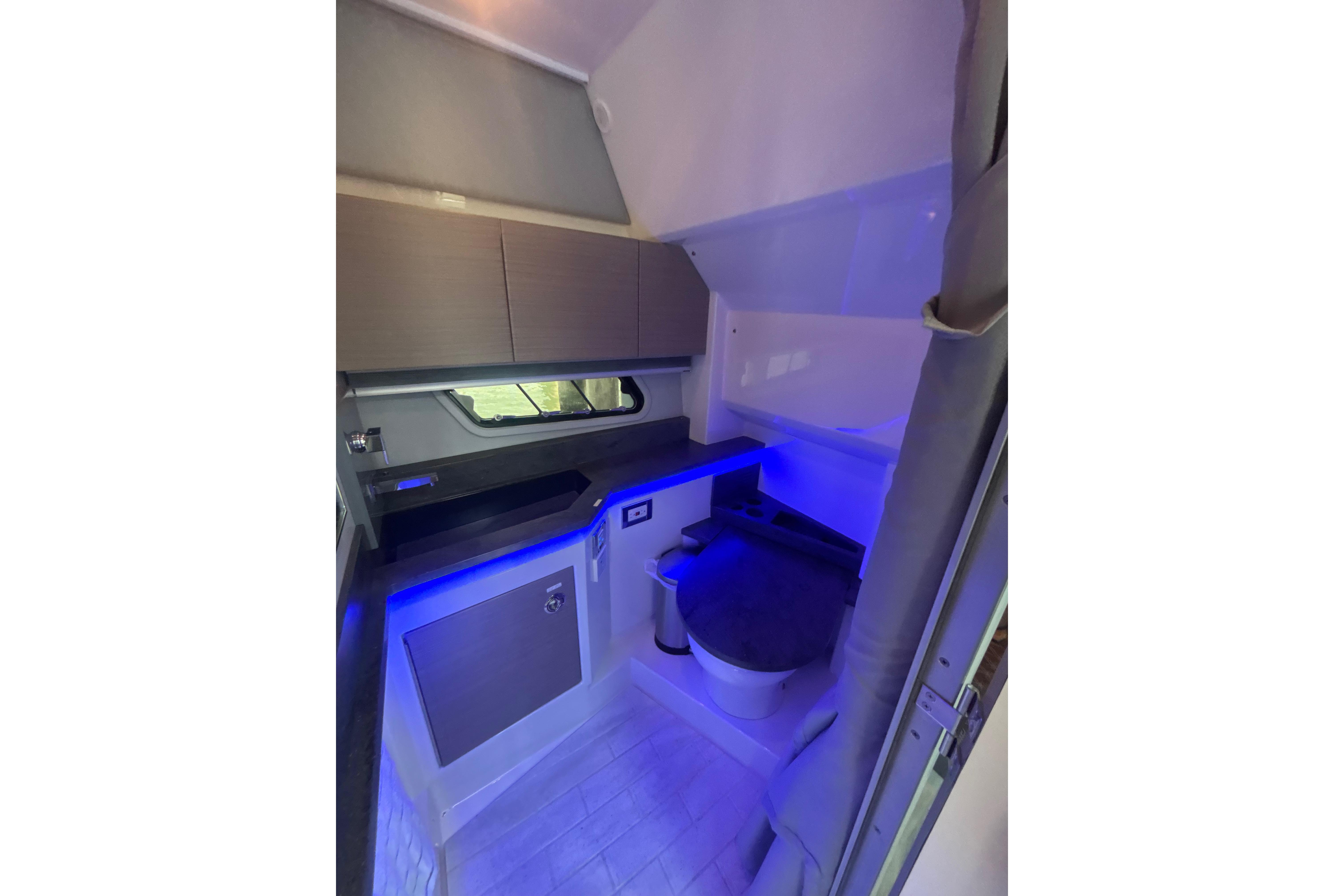 2019 Formula 430 Super Sport Crossover interior with modern design and blue ambient lighting.