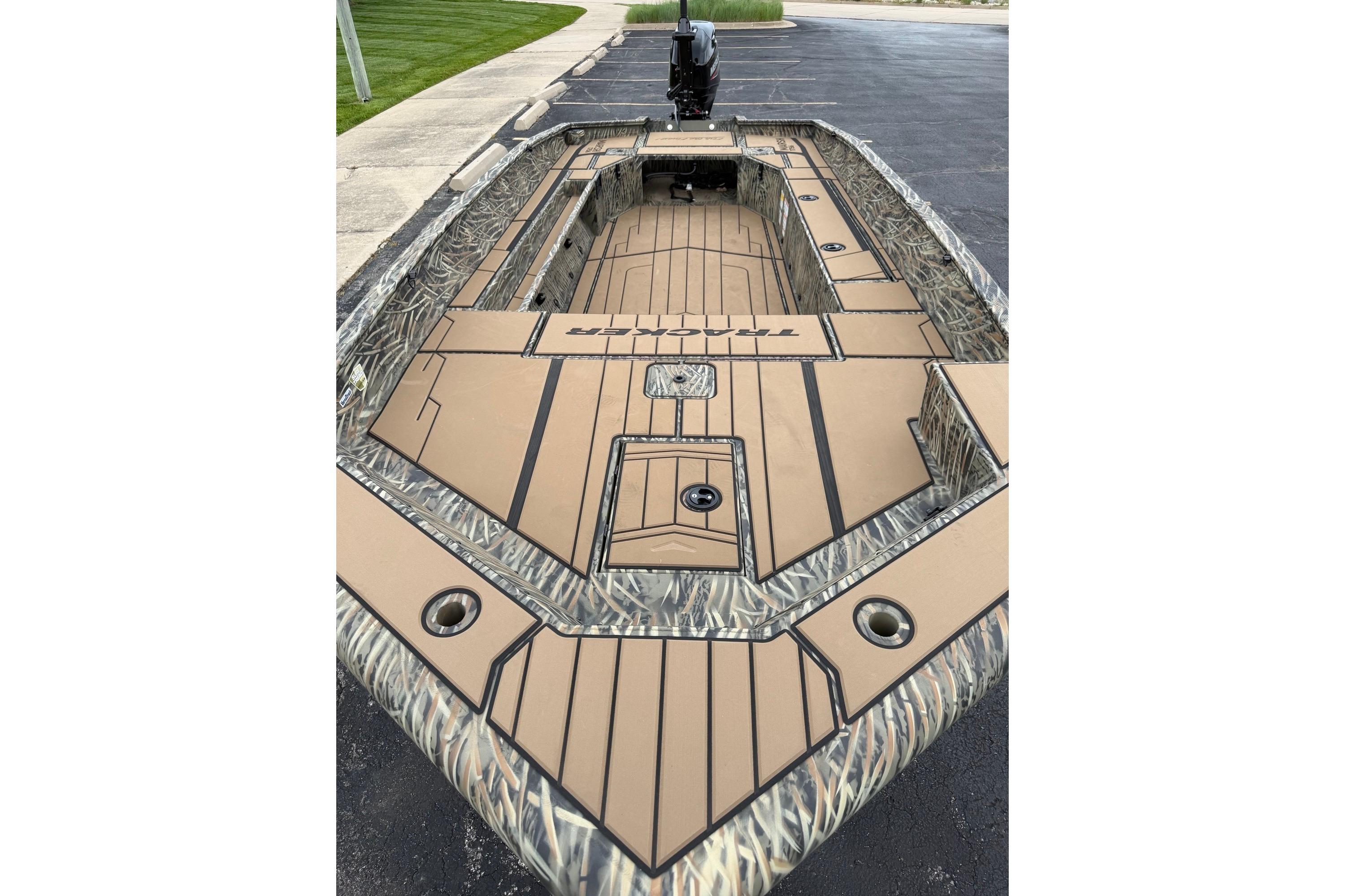 2026 Tracker Grizzly 1756 T Marsh boat with camouflage design and spacious deck layout.