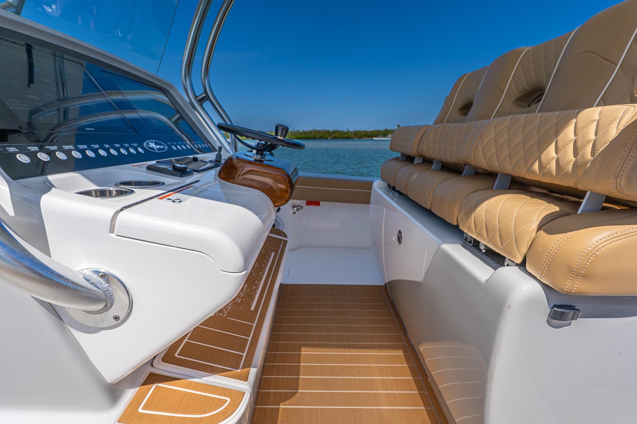 2022 Valhalla Boatworks V-33 interior with luxurious seating and modern dashboard controls.