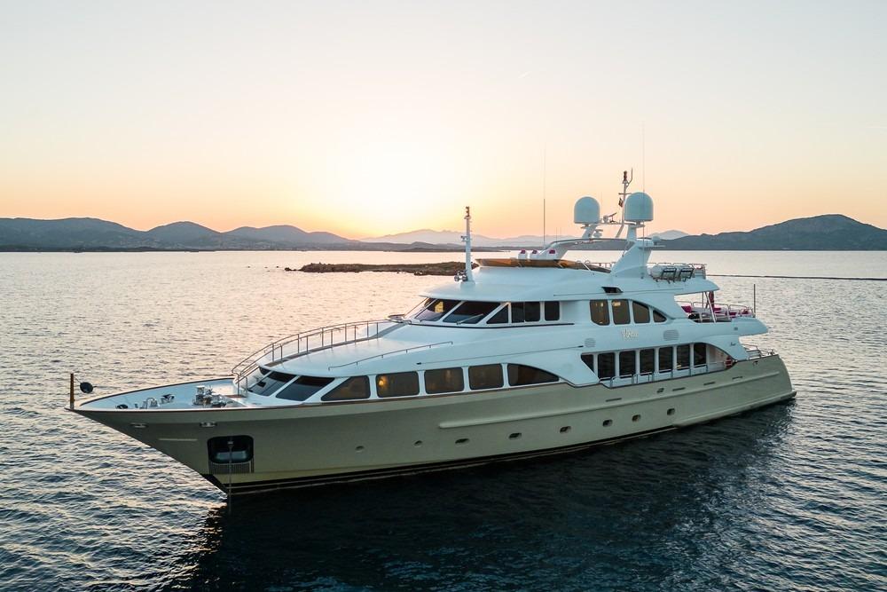 Luxurious 2008 Benetti Classic 120 yacht at sunset on serene waters.