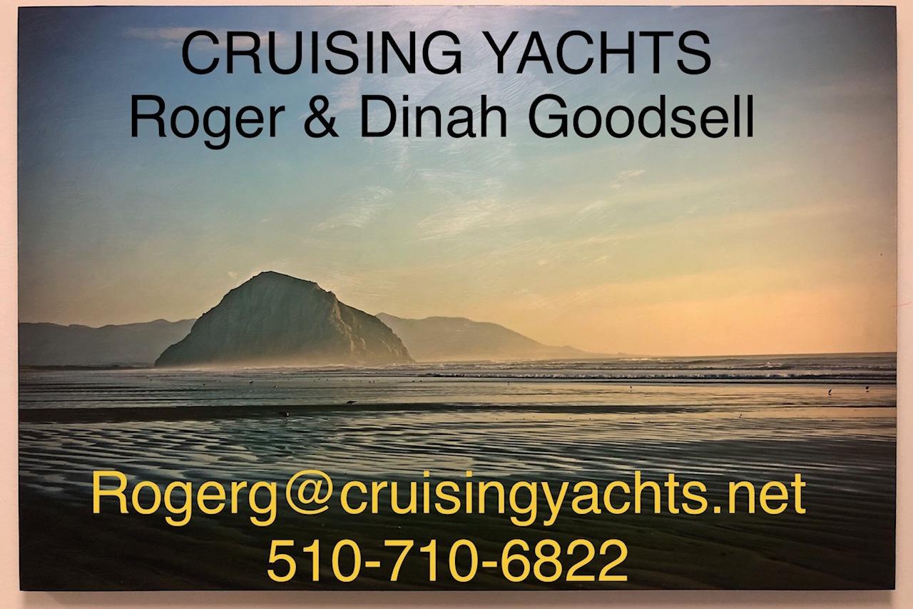 Cruising Yachts contact information over scenic coastal view, Catalina 470, 2000 model.