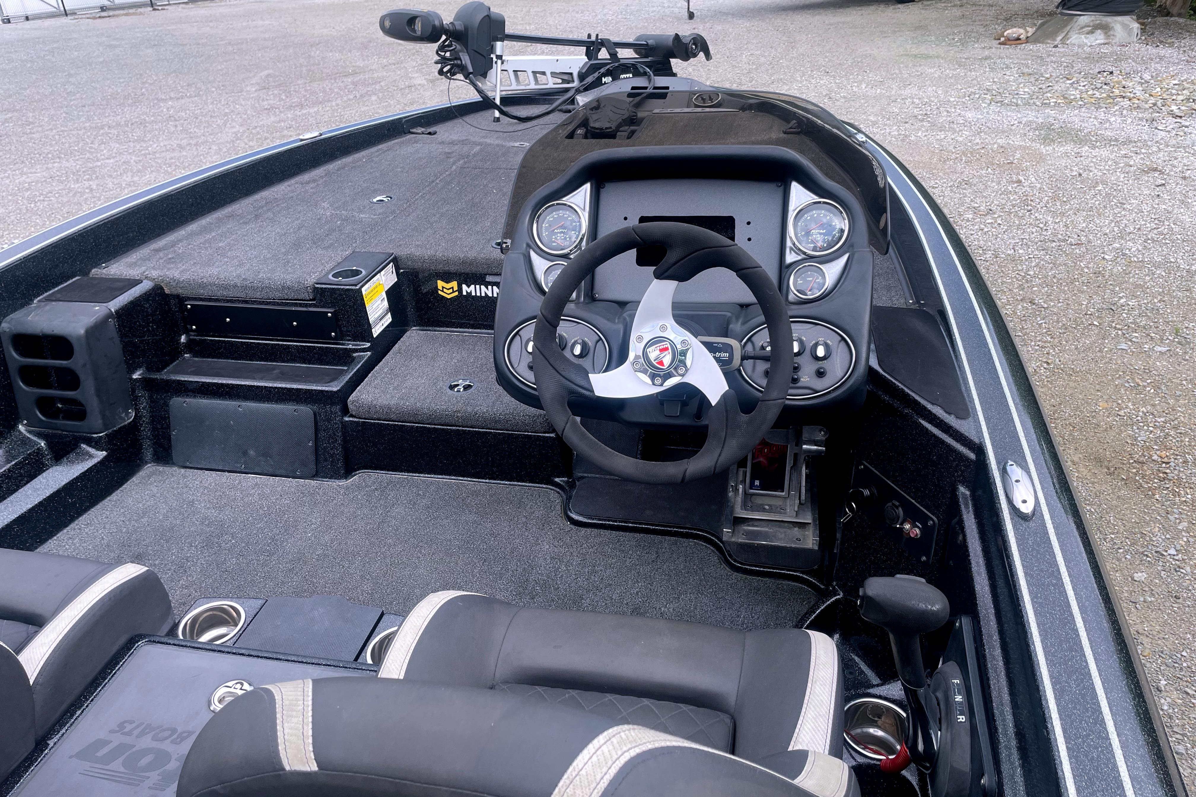 2022 Triton 18 TrX boat interior with steering wheel and dashboard controls.