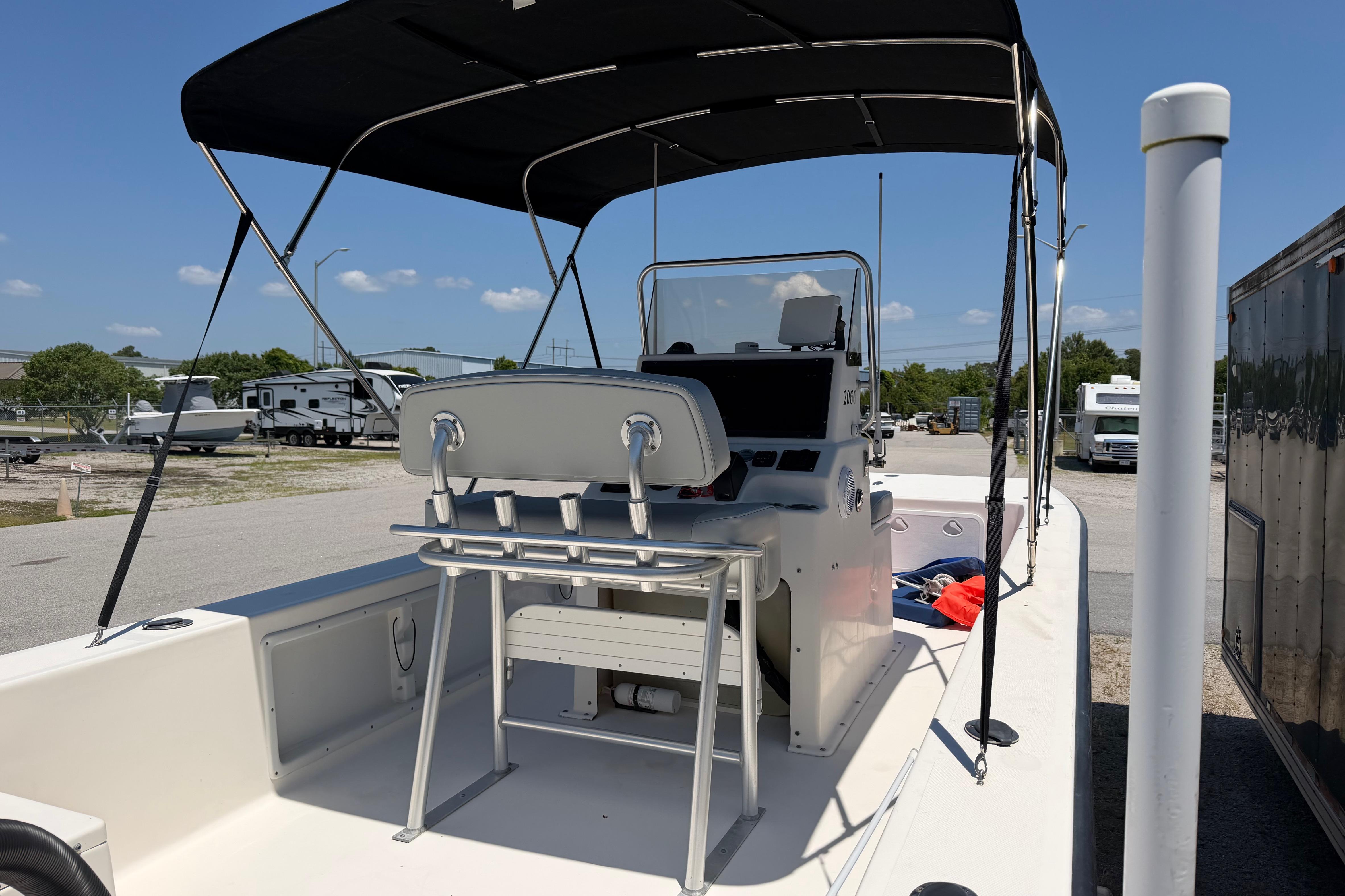 2008 KenCraft Bay Rider 2060 boat with canopy, parked outdoors on a sunny day.