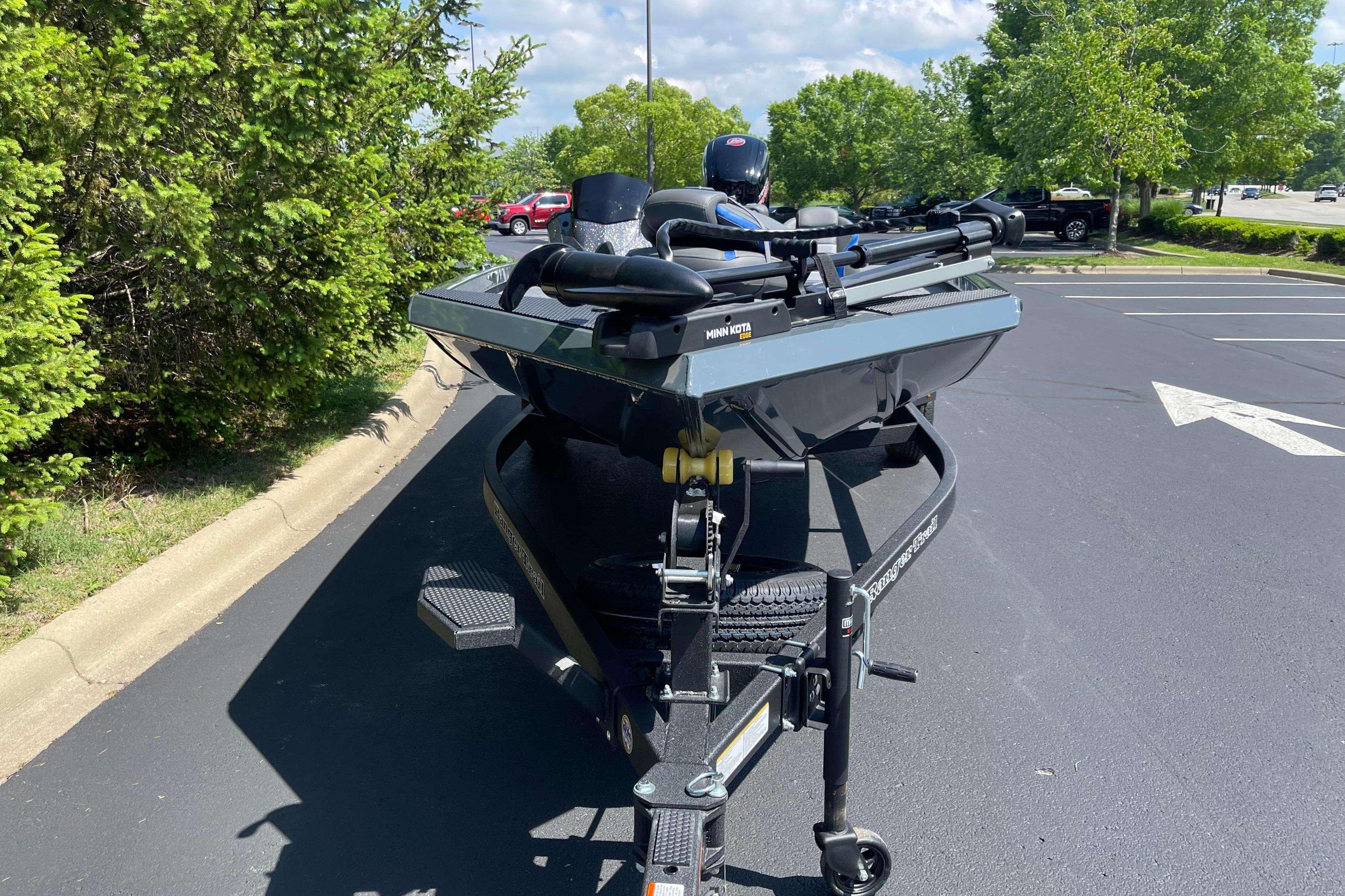 2026 Ranger RT188 boat on trailer in sunny parking lot.