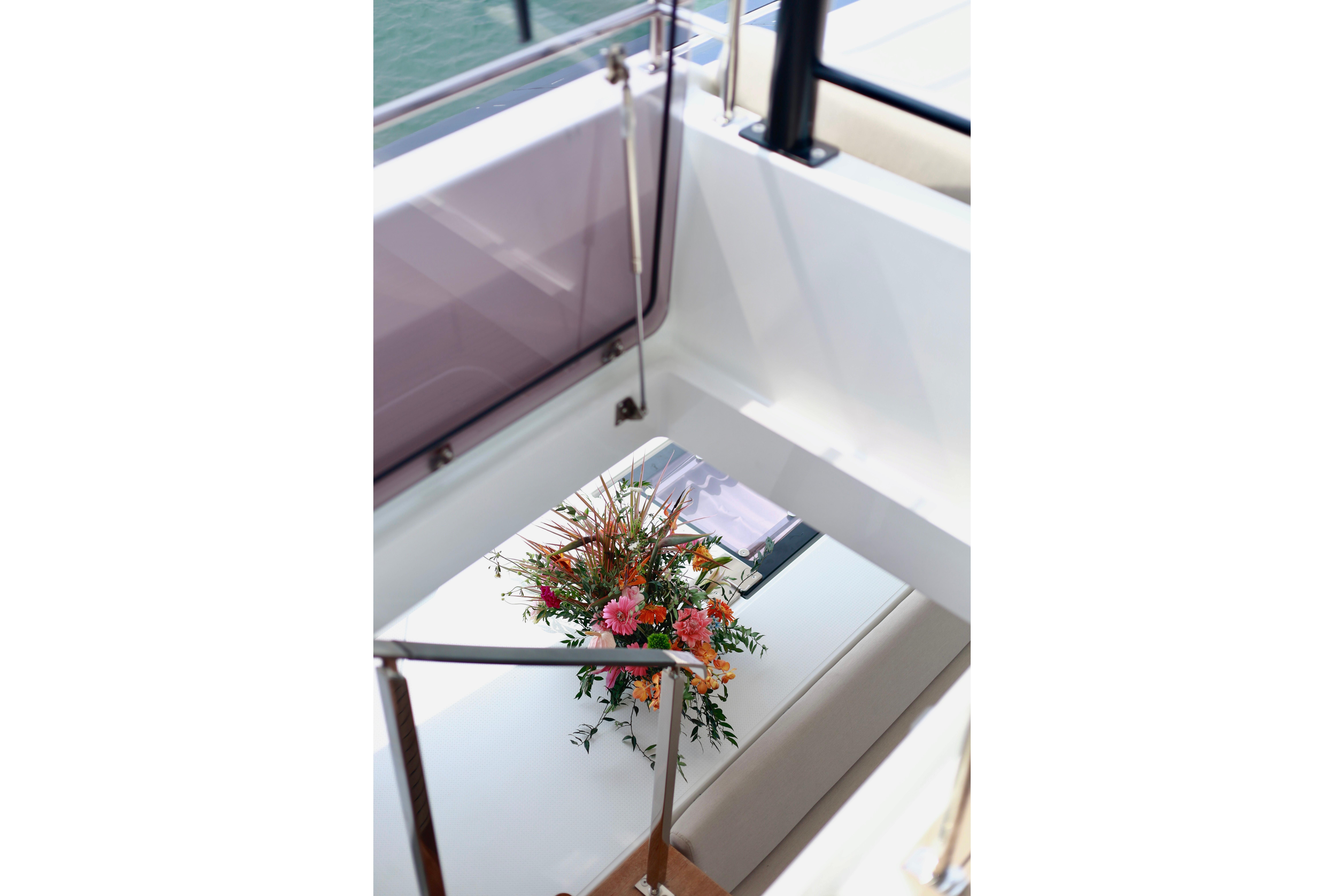 Luxurious 2023 Fountaine Pajot Samana 59 yacht interior with elegant floral arrangement.
