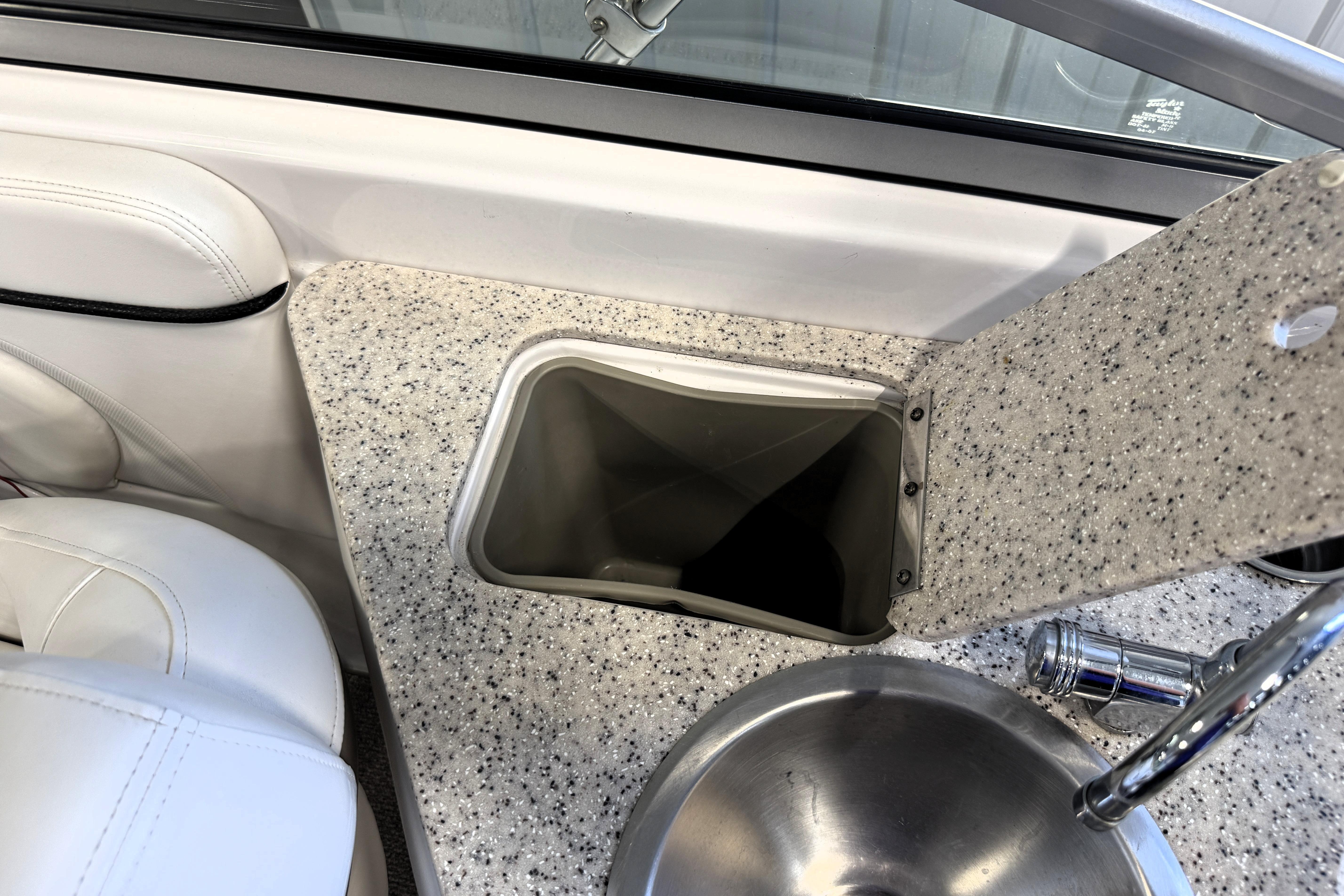 2008 Four Winns H240 boat interior with sink and countertop detail.