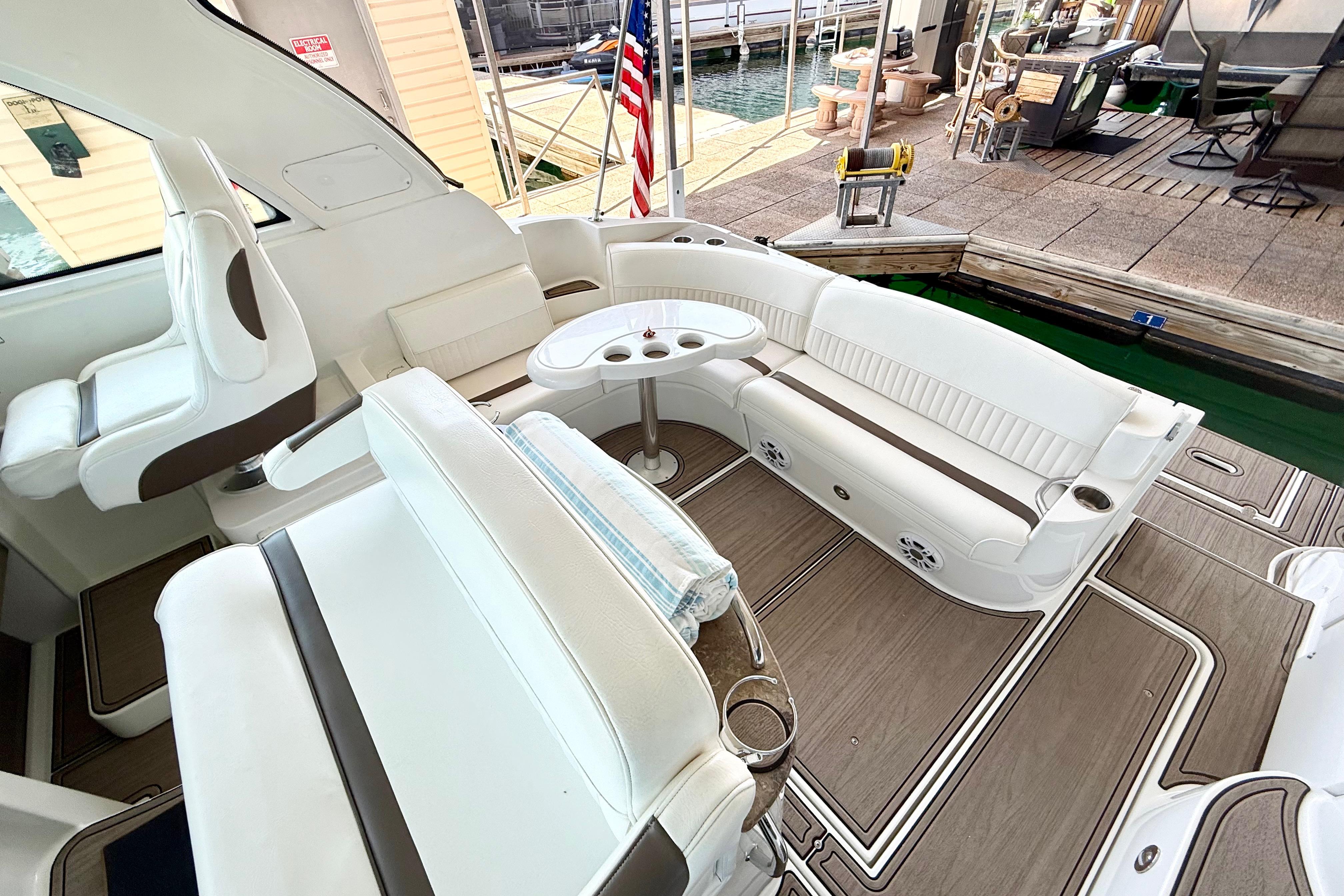 2011 Cruisers Yachts 390 Sports Coupe interior with white seating and wooden flooring.