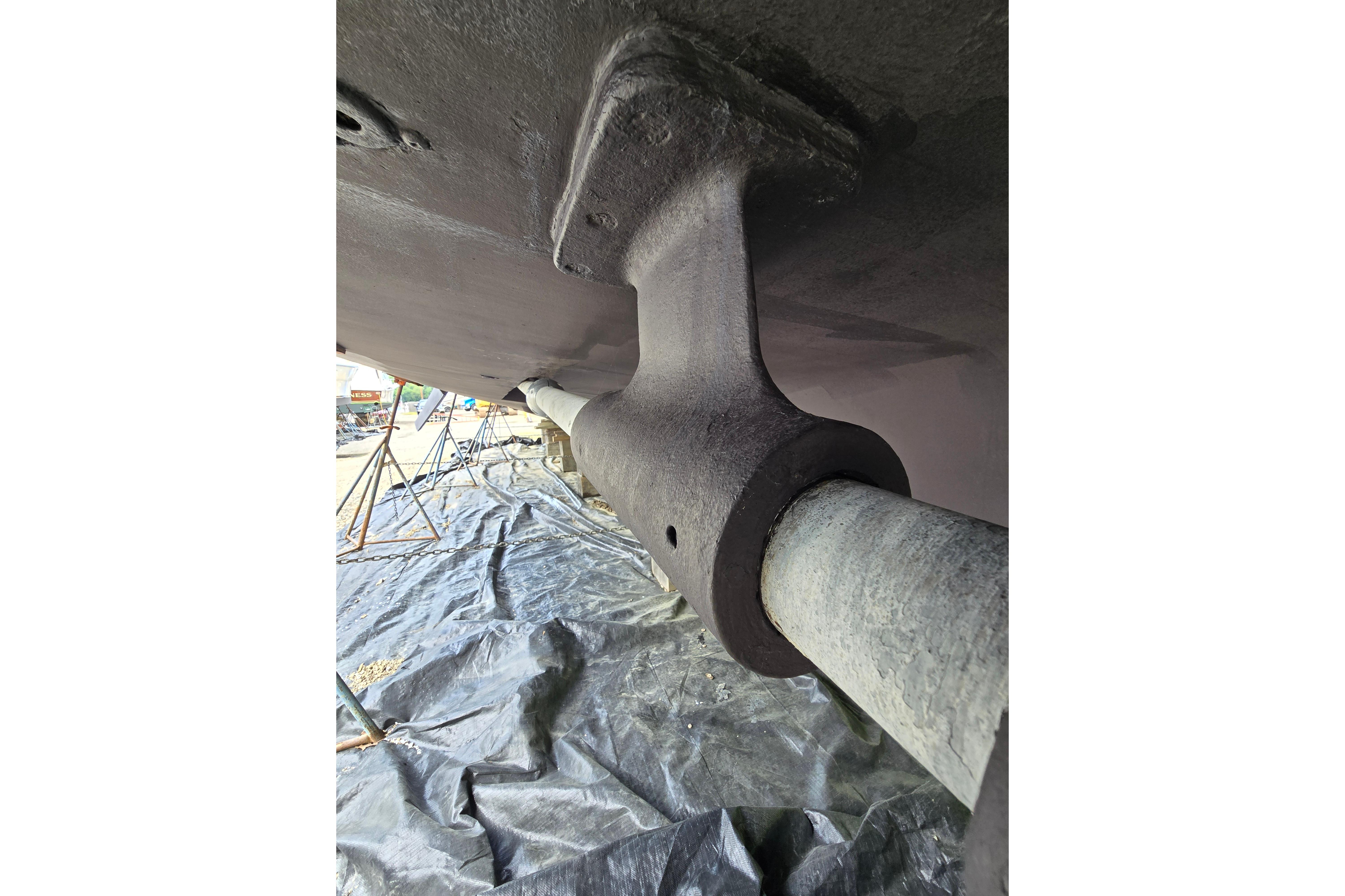 Underwater view of 1980 Hatteras 70 Motor Yacht propeller shaft and support.