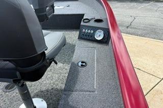 2025 Tracker Super Guide V-16 T boat interior with seating and control panel.