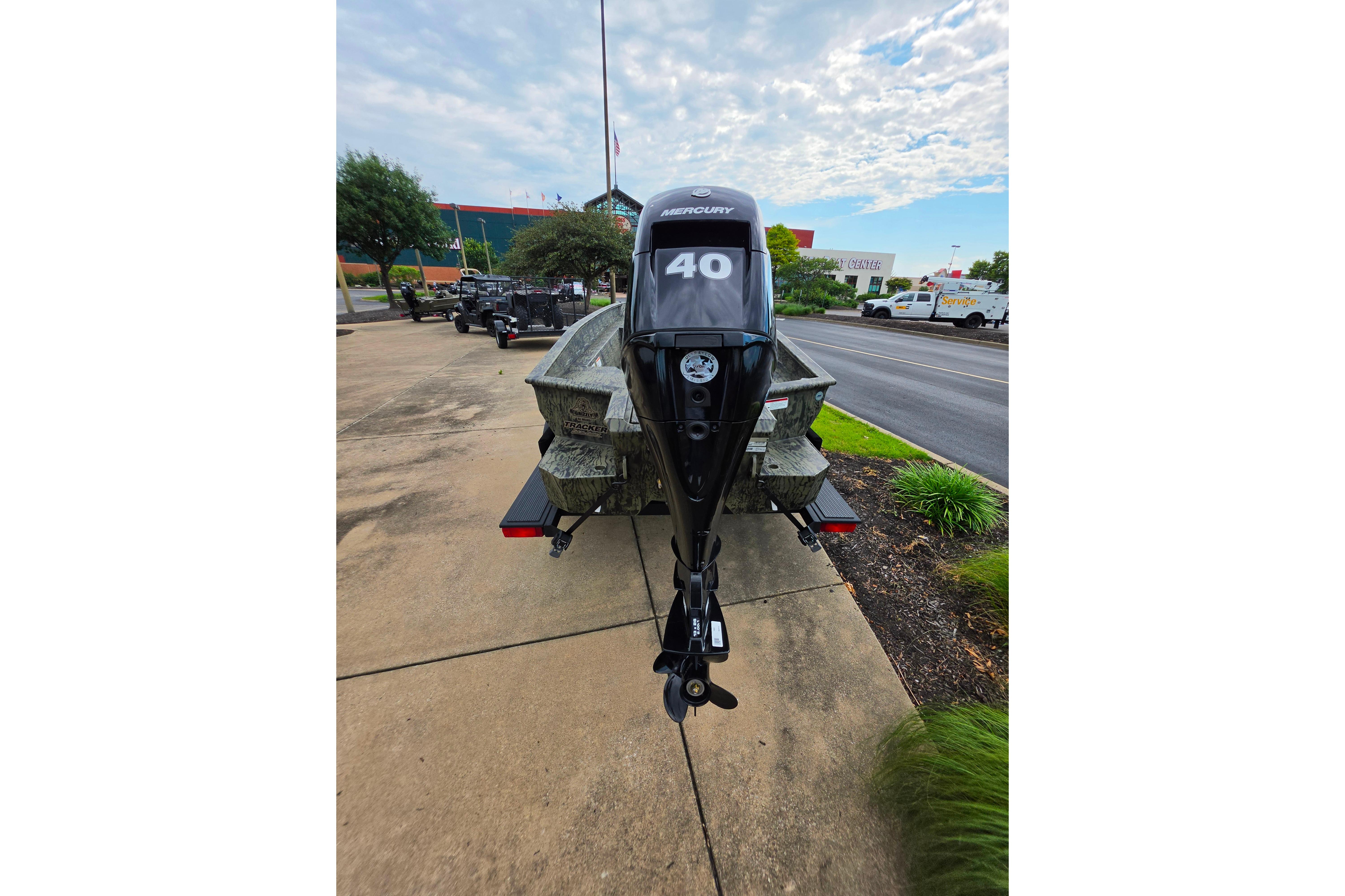 2026 Tracker Grizzly 1650 T Prairie Wings Edition boat with Mercury 40 outboard motor.
