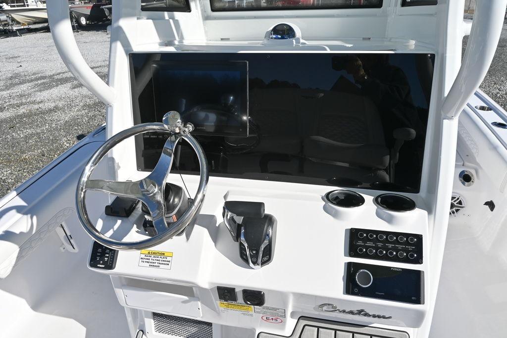 2026 Tidewater 2500 Carolina Bay boat dashboard with steering wheel and controls.