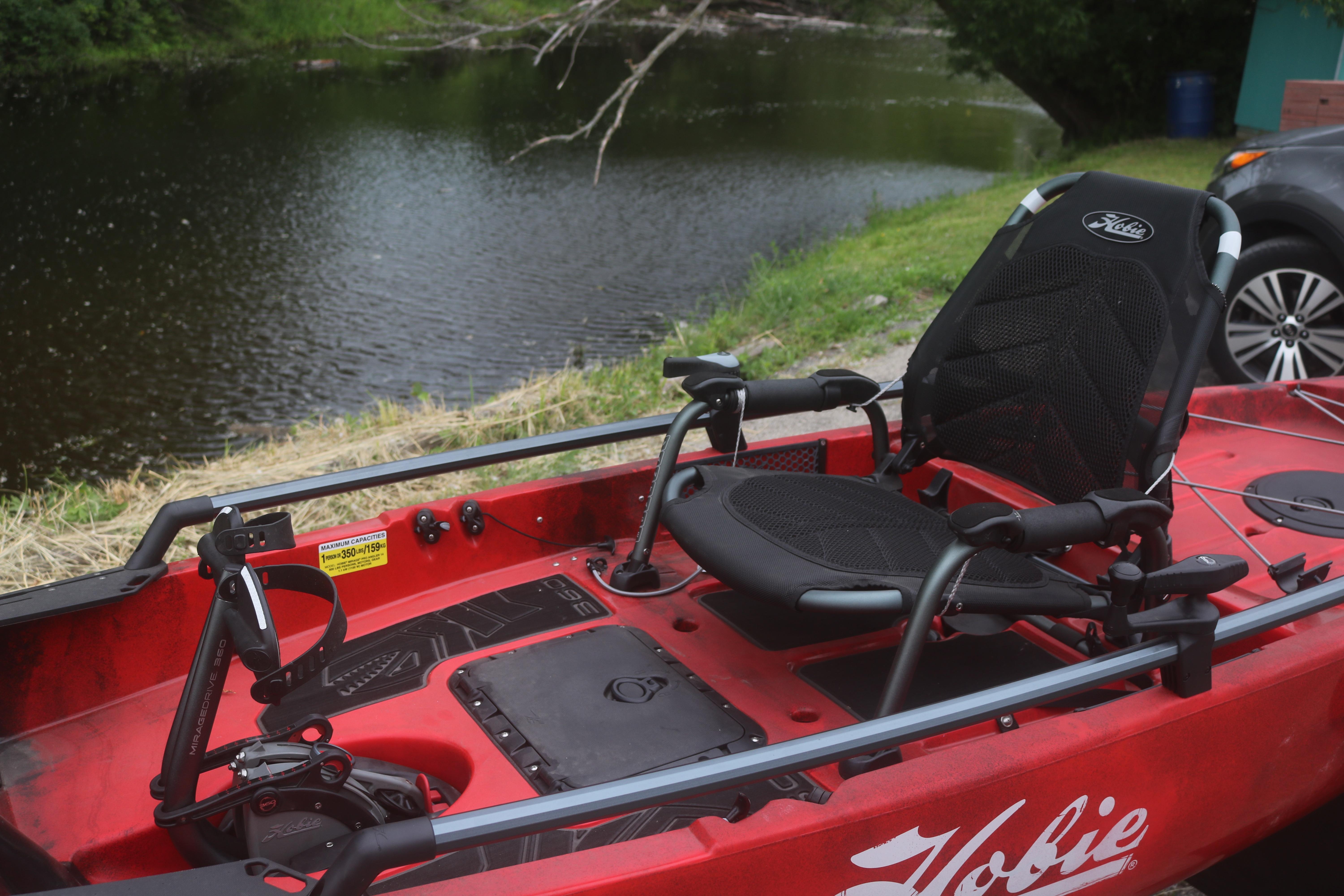 2023 Hobie Mirage Pro Angler 14 kayak by a serene riverside.