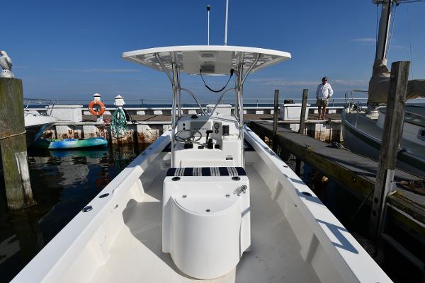 2021 Eastern 248 Center Console boat docked at a marina on a sunny day.