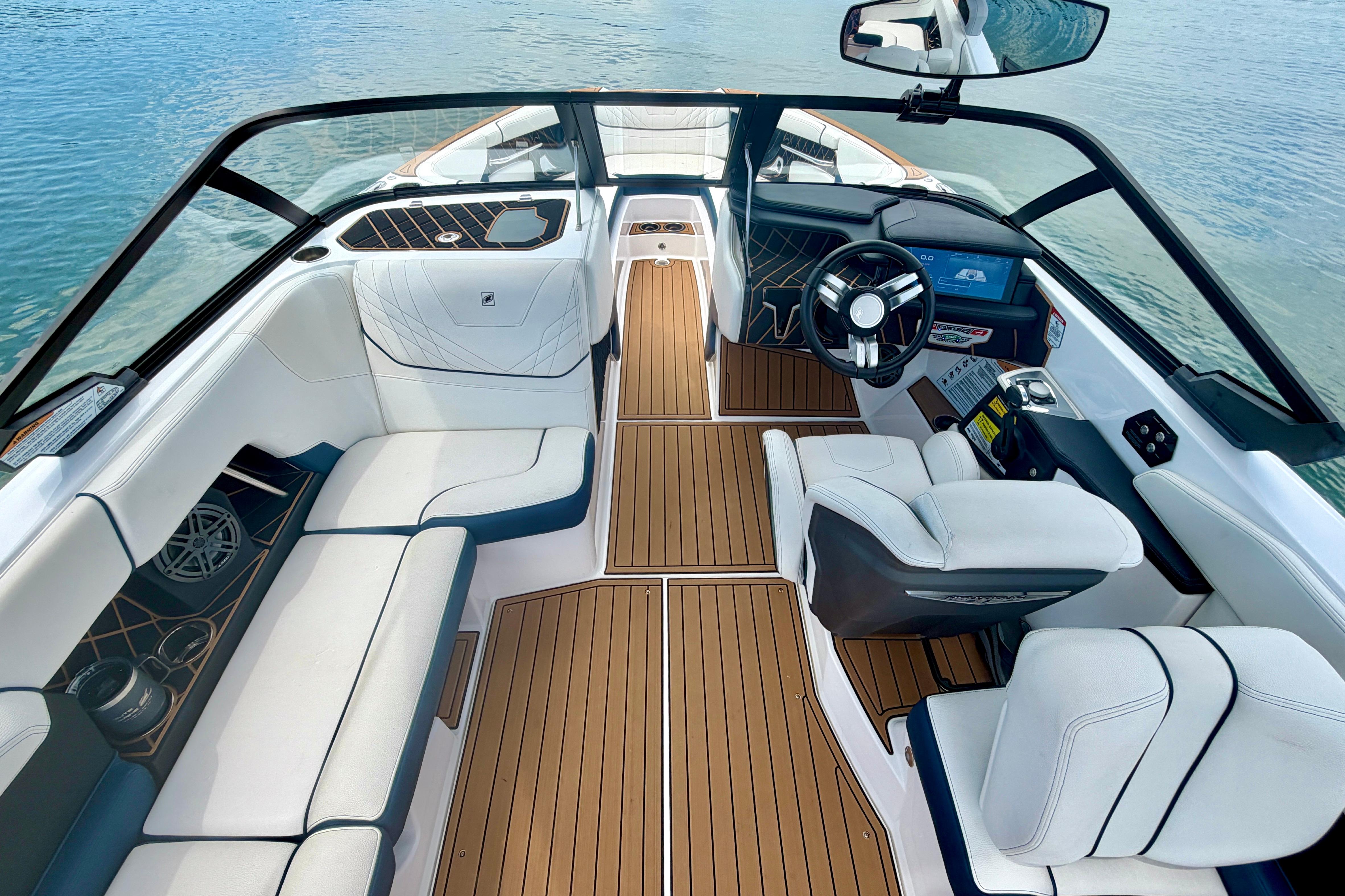 2022 Nautique Super Air Nautique GS24 interior with luxurious seating and modern dashboard.