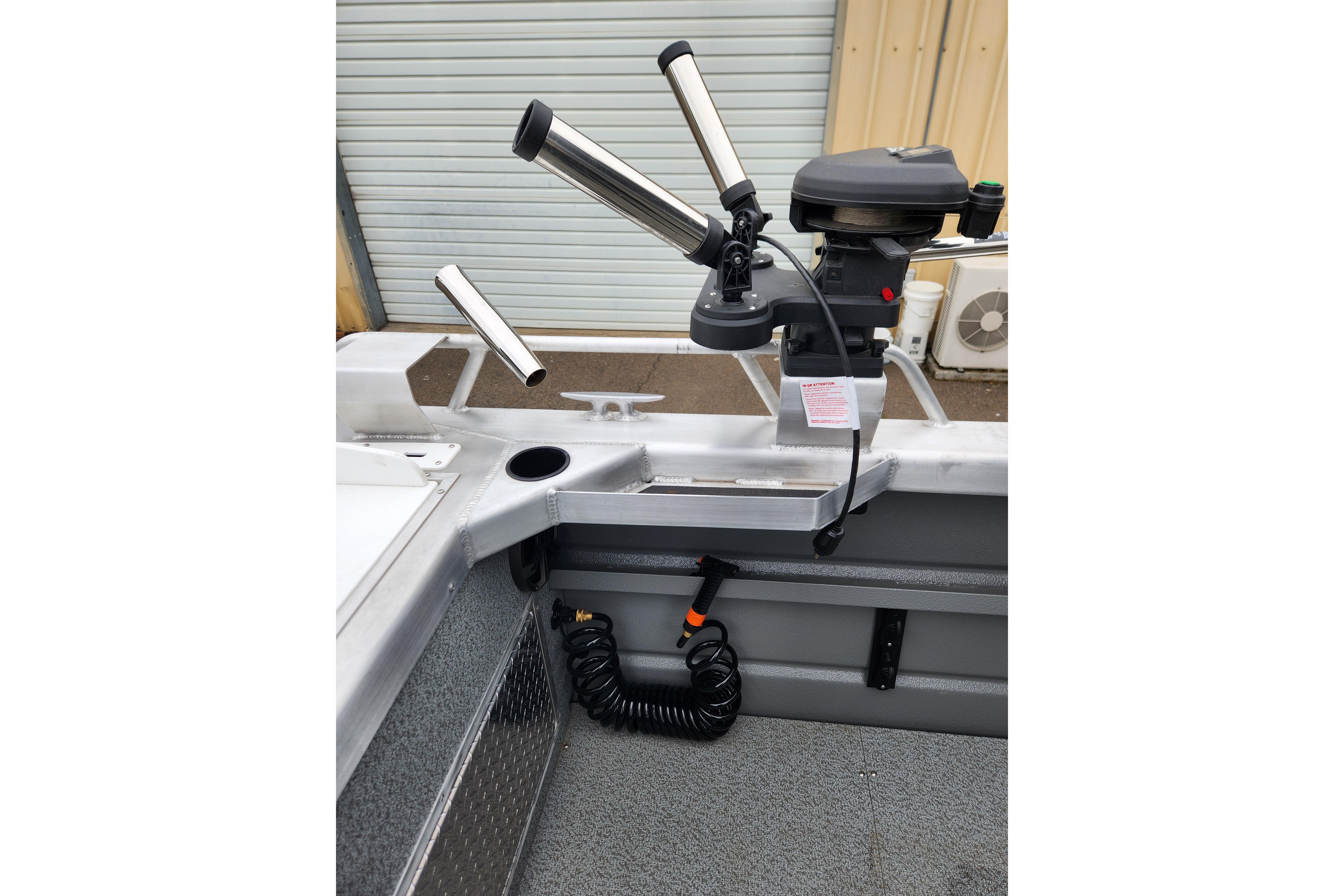 2025 Thunder Jet 21 Chinook OS boat interior with rod holders and motor detail.