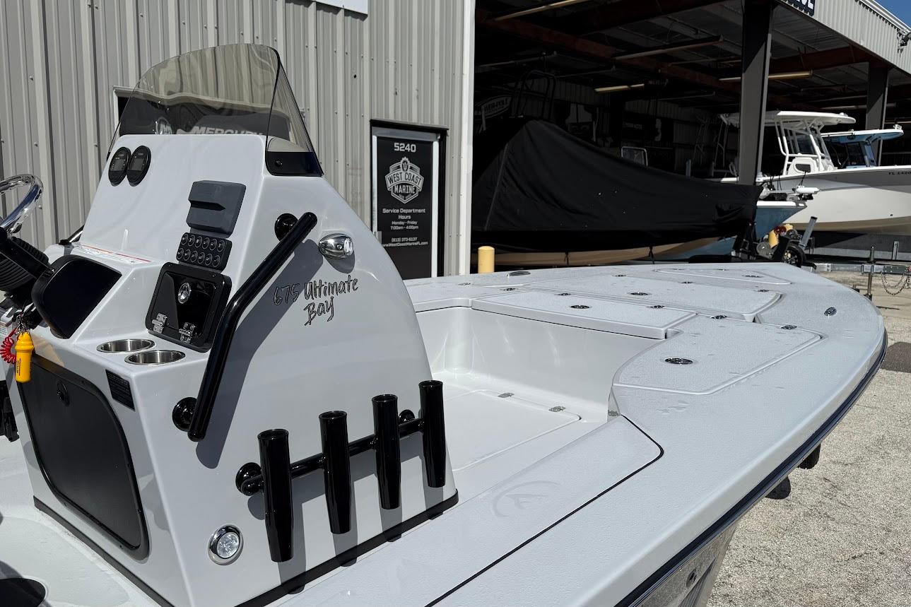2026 Blazer 675 Ultimate Bay boat at marina, featuring sleek design and modern controls.