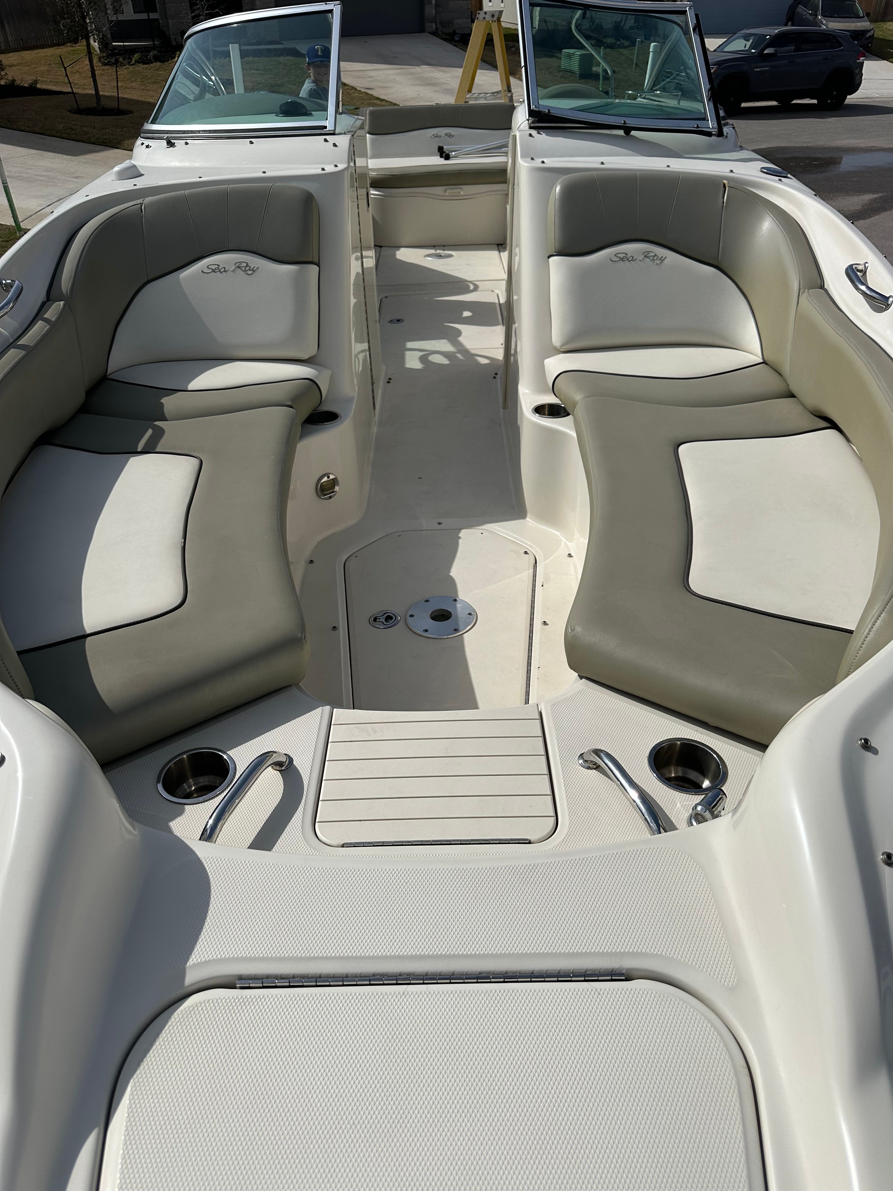 Interior of a 2006 Sea Ray 240 Sundeck boat with seating area.