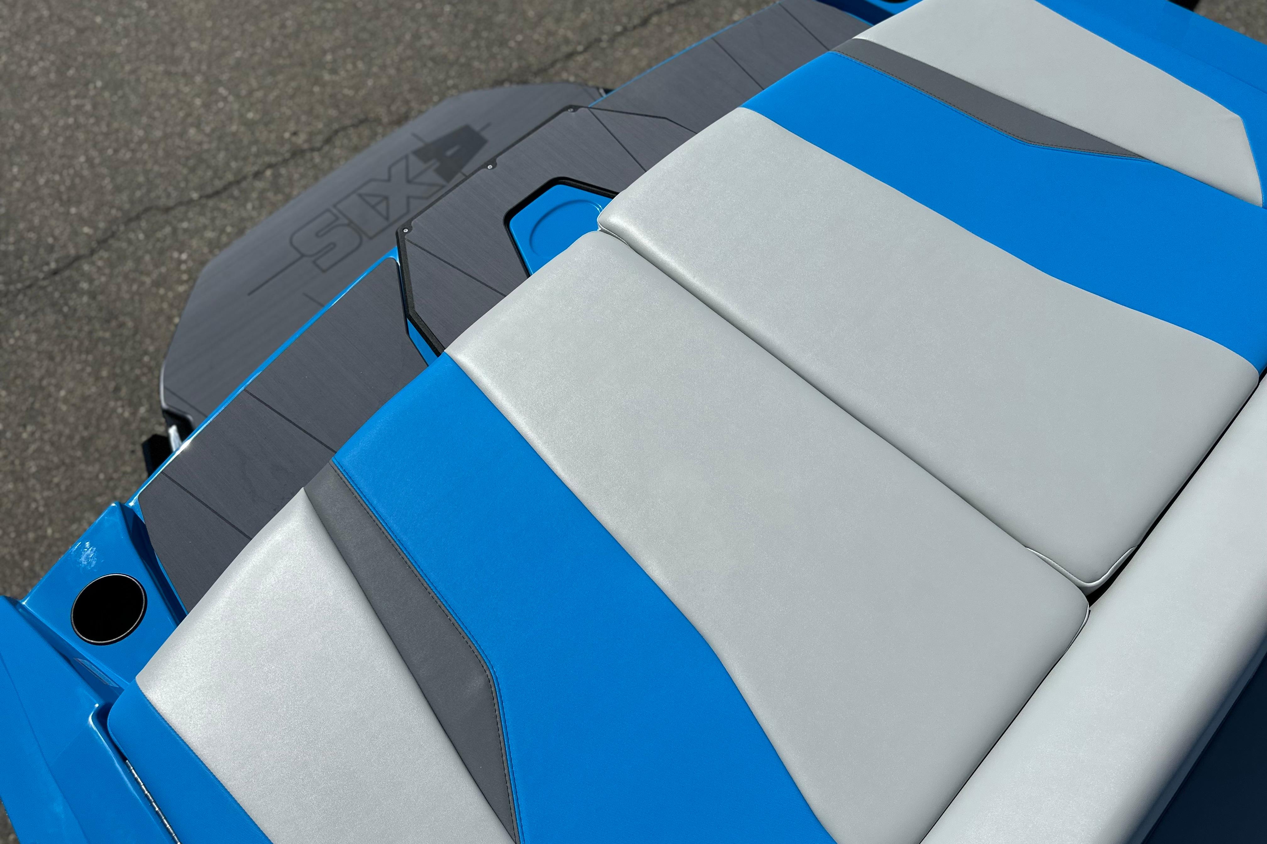 2026 Axis T235 boat with blue and gray seating, sleek modern design.