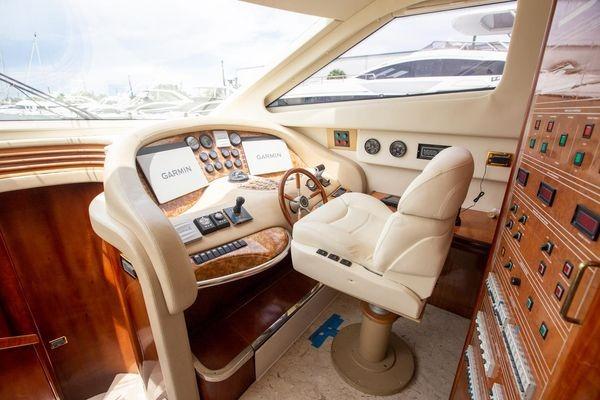 Luxurious helm of 2003 Azimut 74 Solar yacht with advanced navigation controls.