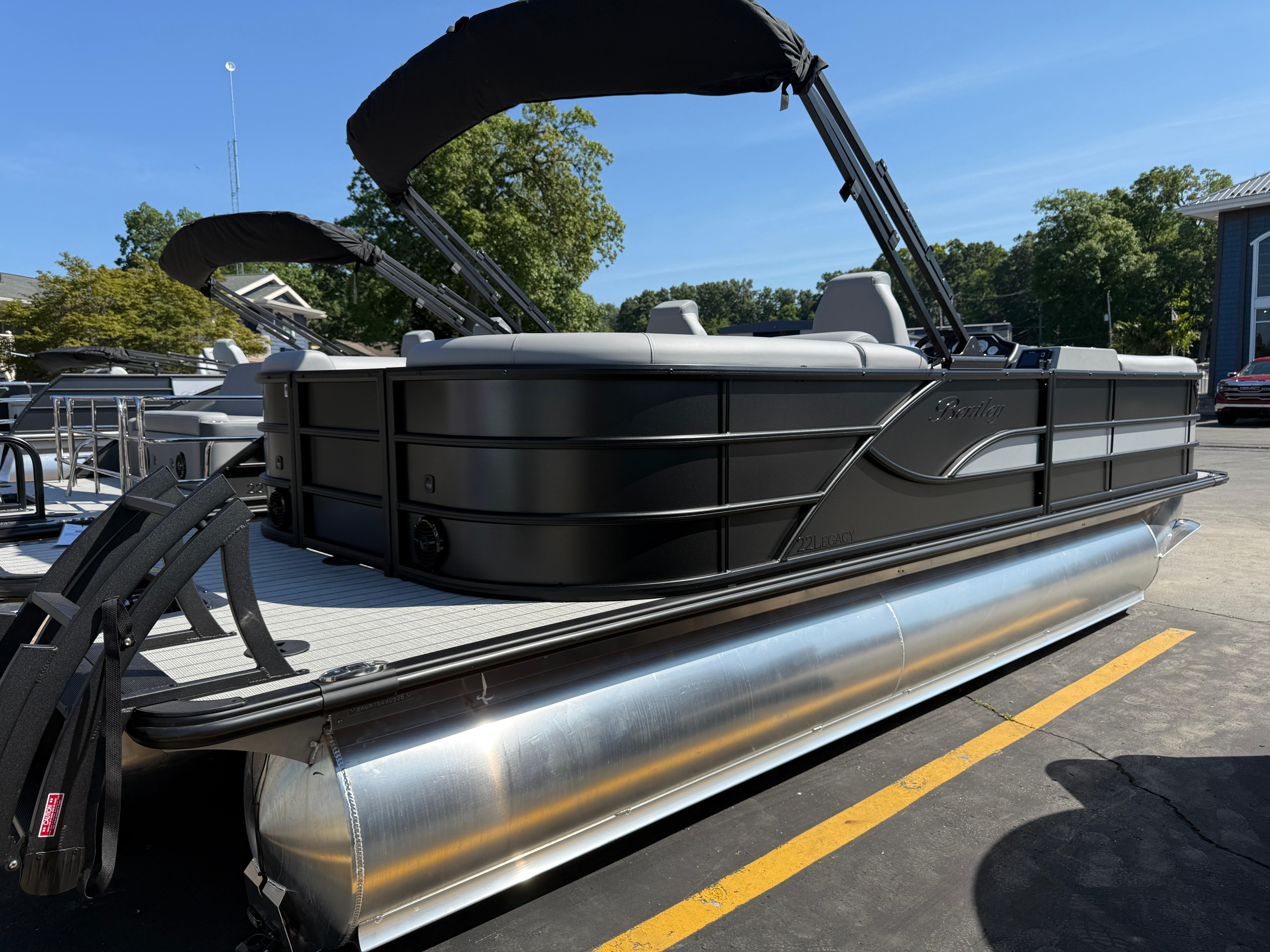 2026 Bentley Pontoons Legacy 223 Navigator, sleek design, docked outdoors.