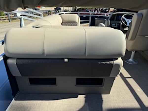 Interior of 2025 Sun Tracker Fishin' Barge 22 DLX with beige seating.
