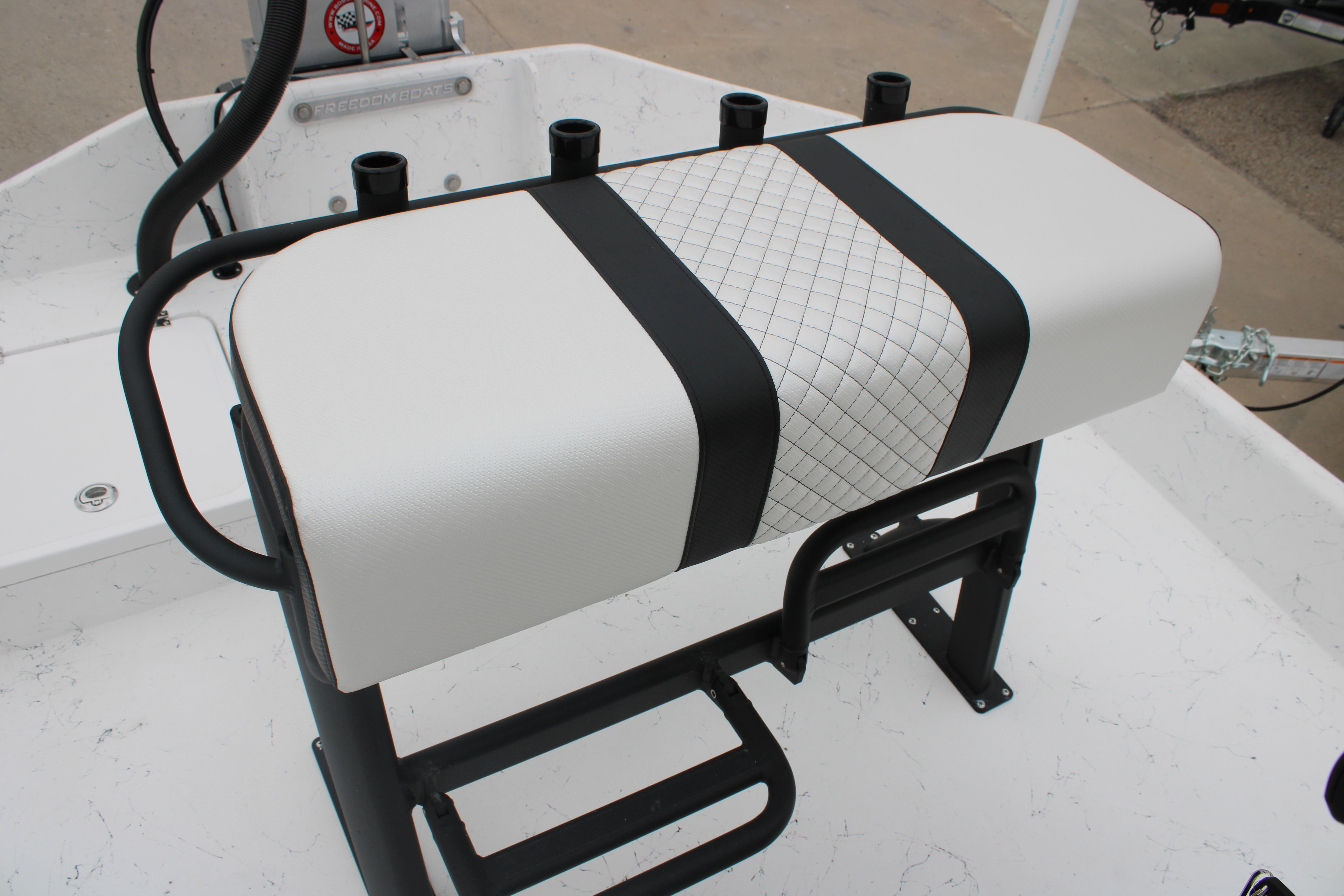2026 Freedom Boats 16' Eagle seat with black and white design, featuring rod holders.