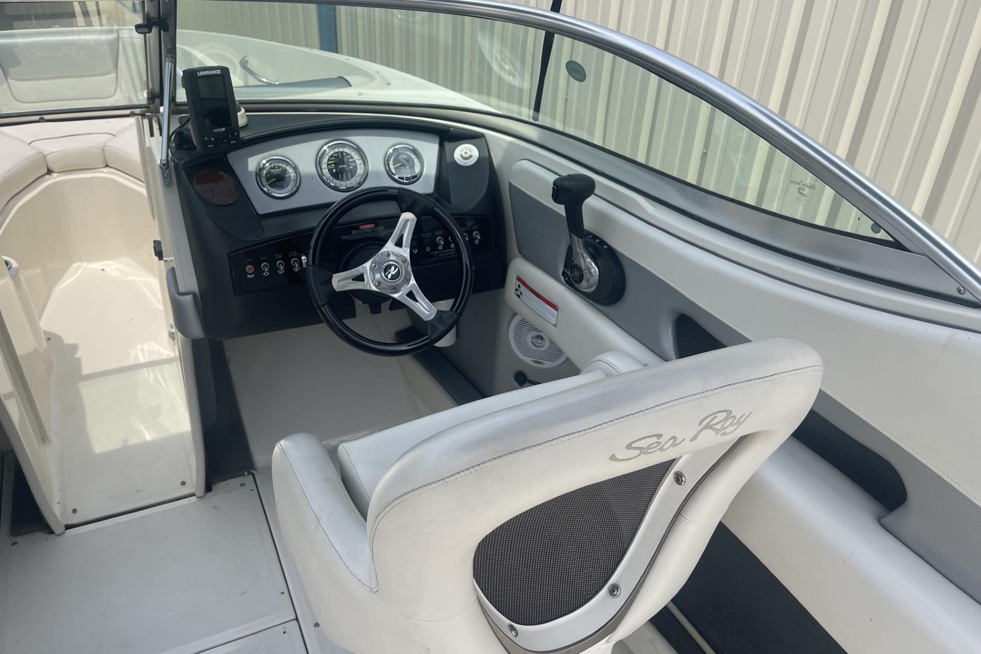 Interior view of 2010 Sea Ray 230 Bow Rider Select boat cockpit and controls.