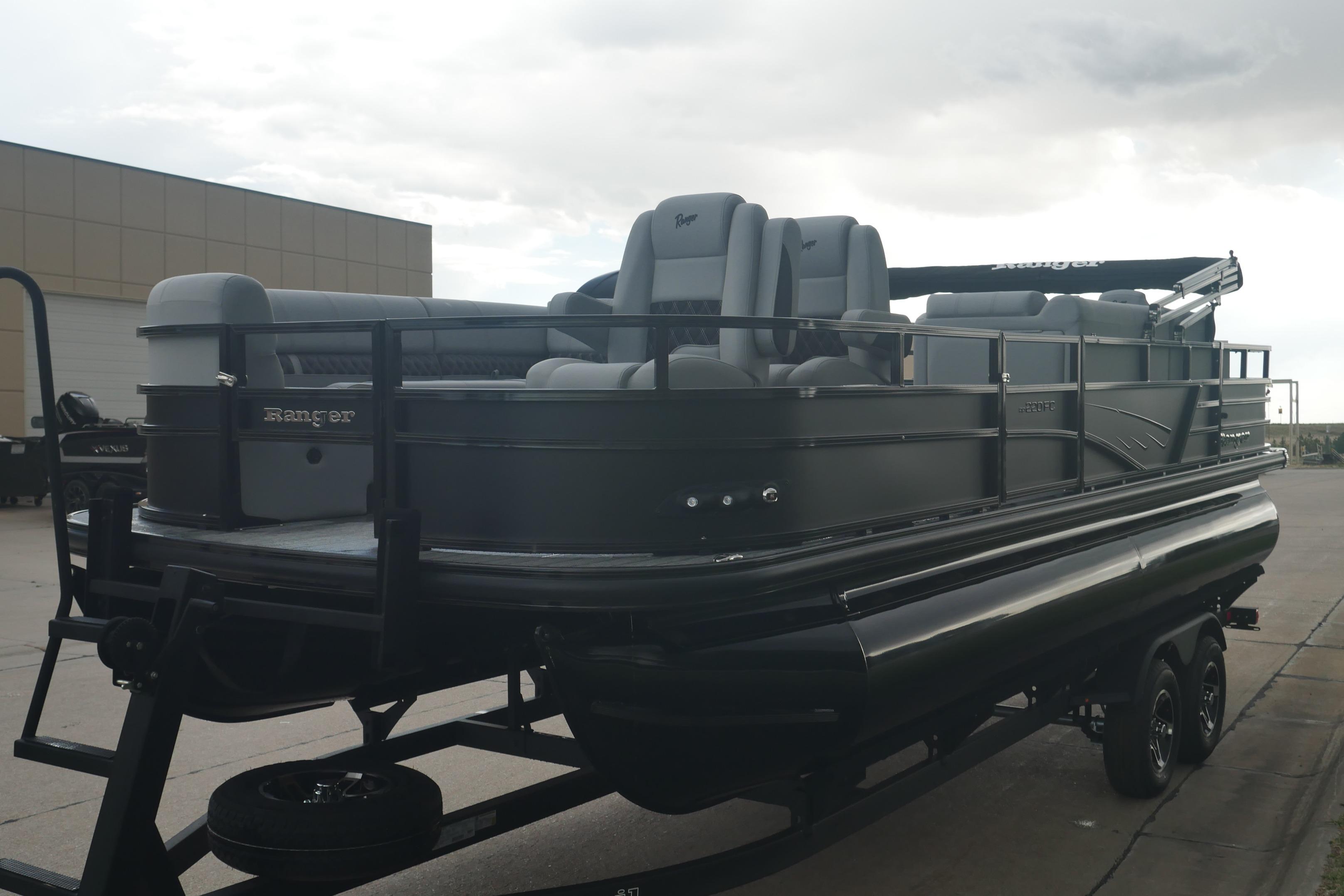 2026 Ranger 220FC pontoon boat on trailer, featuring sleek design and spacious seating.