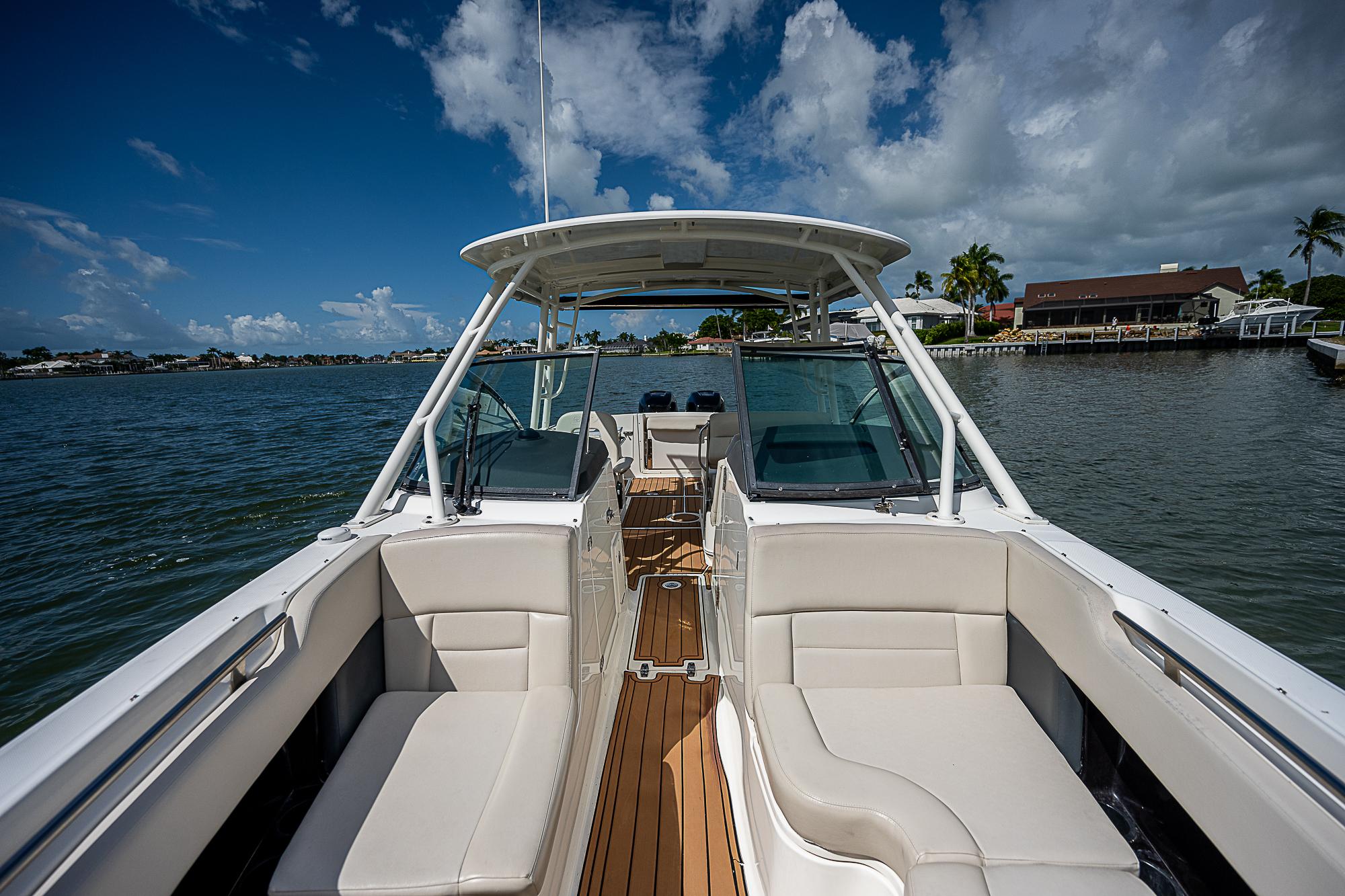 2018 Boston Whaler 270 Vantage boat on water, featuring spacious seating and sleek design.