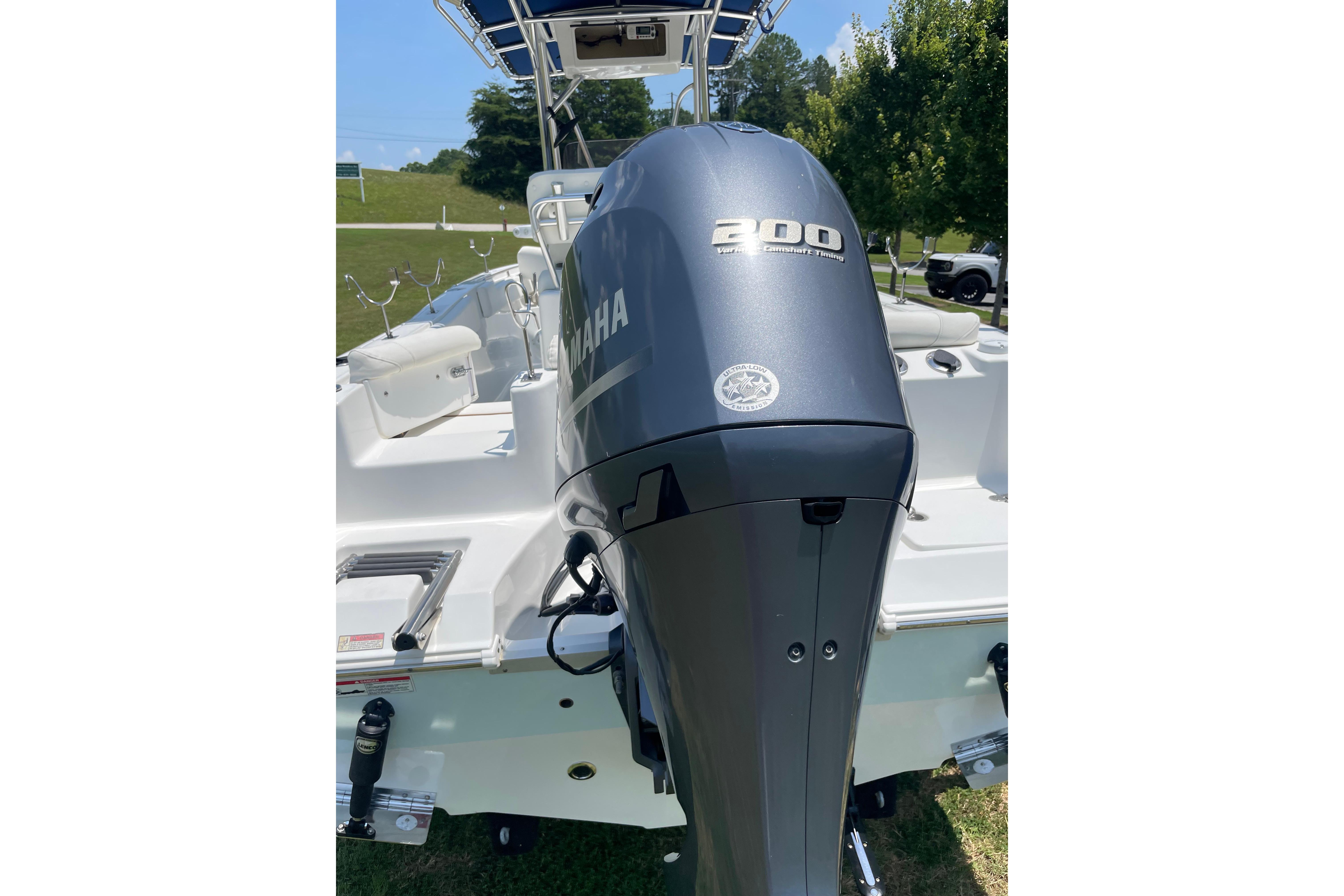 2018 Sea Hunt Ultra 234 boat with Yamaha 200 outboard motor, parked outdoors.