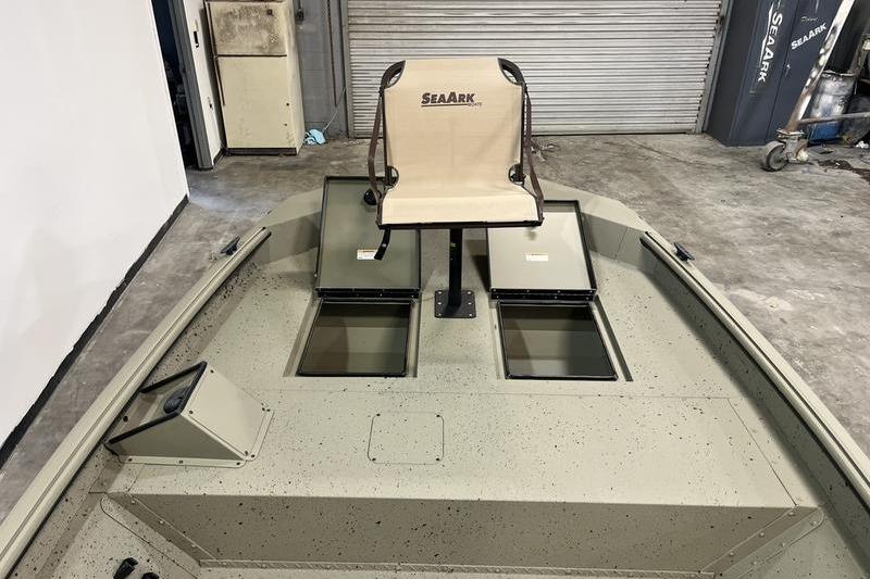 2025 SeaArk Shadow 18T boat interior with fishing seat and storage compartments.