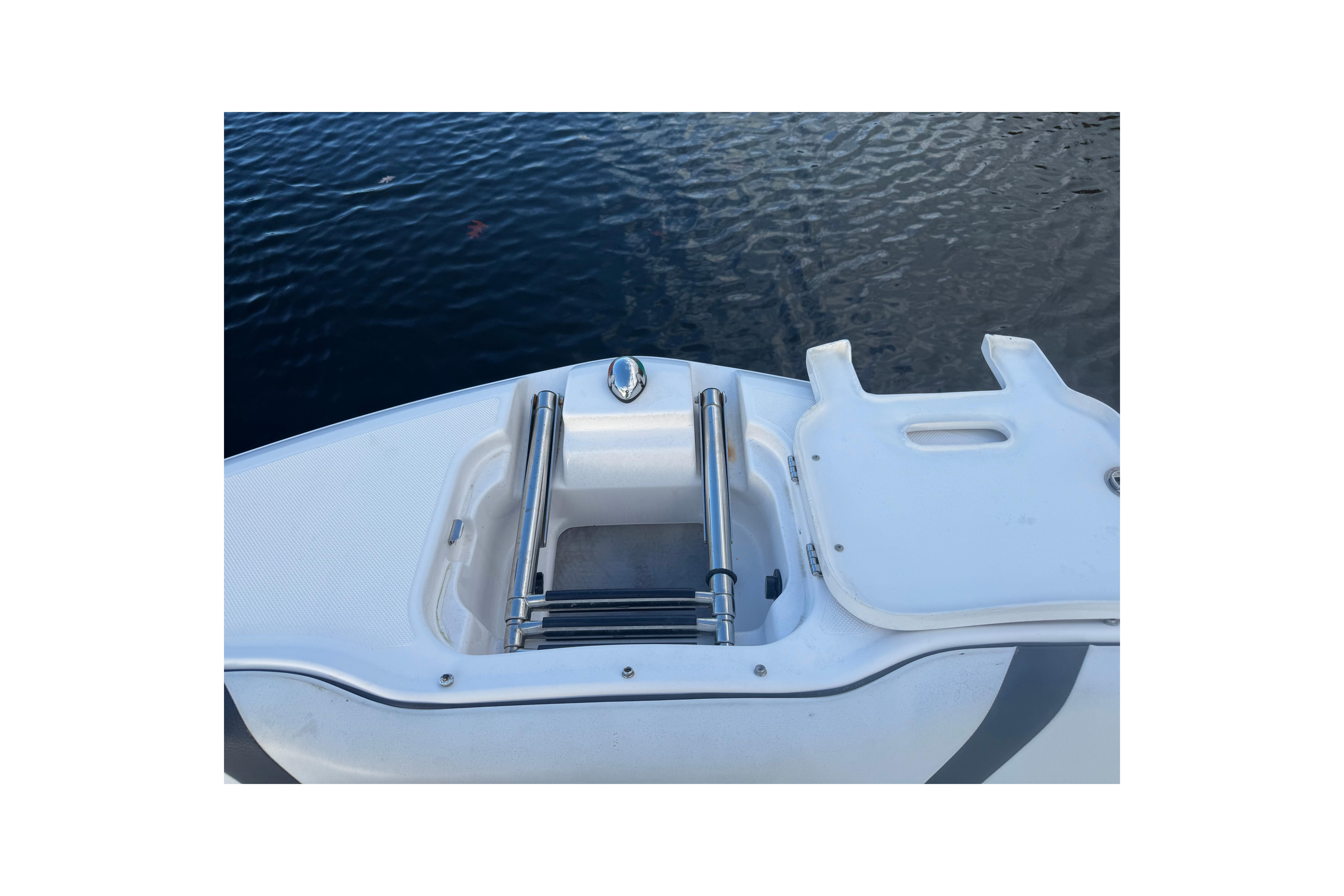 2017 Regal 23 OBX boat bow with ladder and water view.
