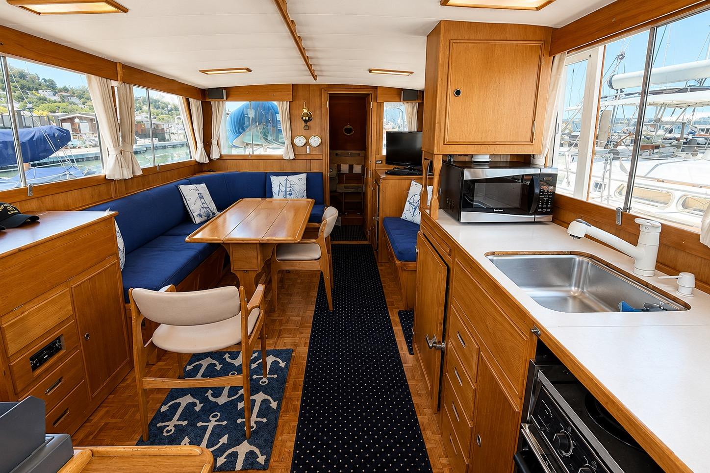 Interior of 1989 Grand Banks 42 Classic yacht with kitchen and dining area.