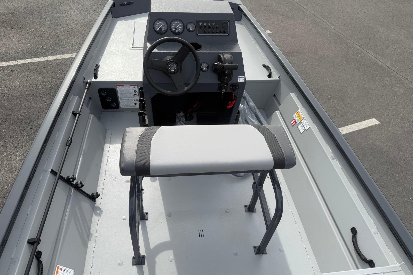 2026 Crestliner 1760 Retriever FCC boat interior with steering console and seating.