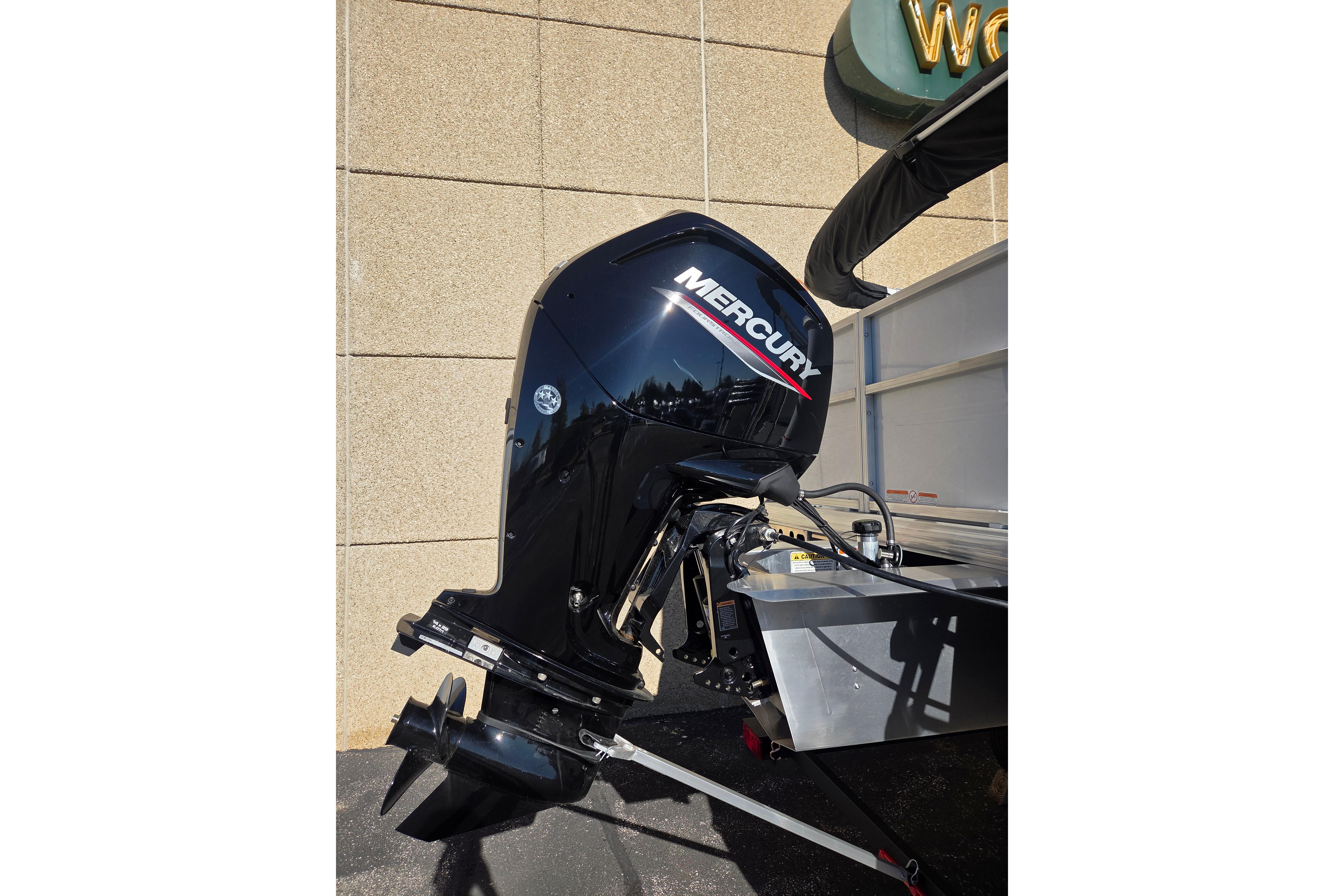2026 Sun Tracker Party Barge 18 DLX with Mercury outboard motor.