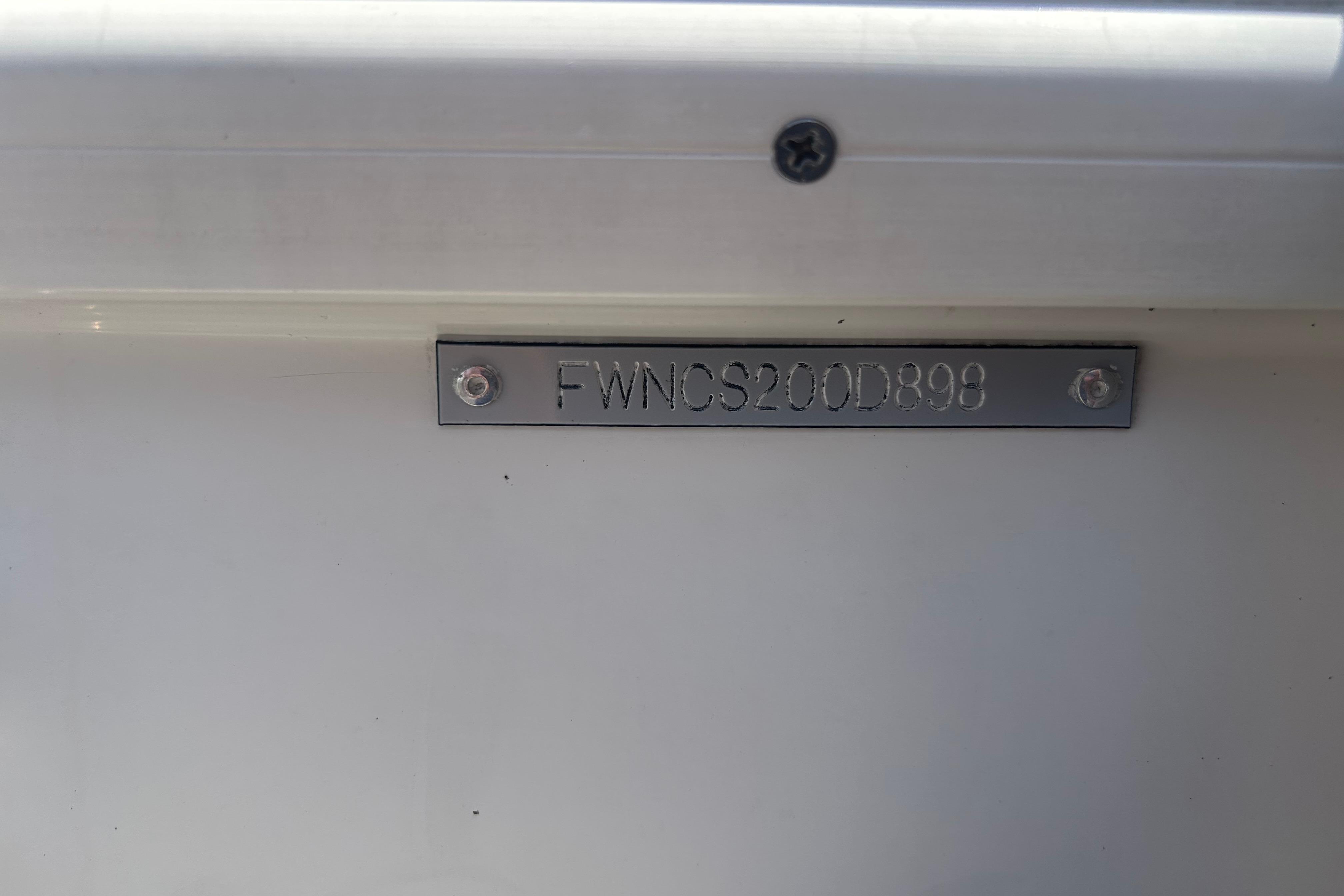 1998 Four Winns 258 Vista boat identification plate with serial number.
