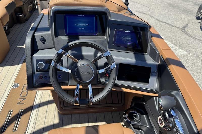 2026 Avalon Excalibur LTD Quad Lounge boat dashboard with modern controls and steering wheel.