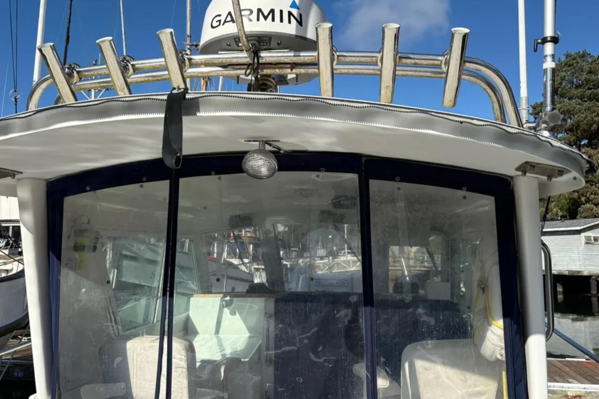 2005 Albin 28 Tournament Express boat with Garmin radar, docked in marina.