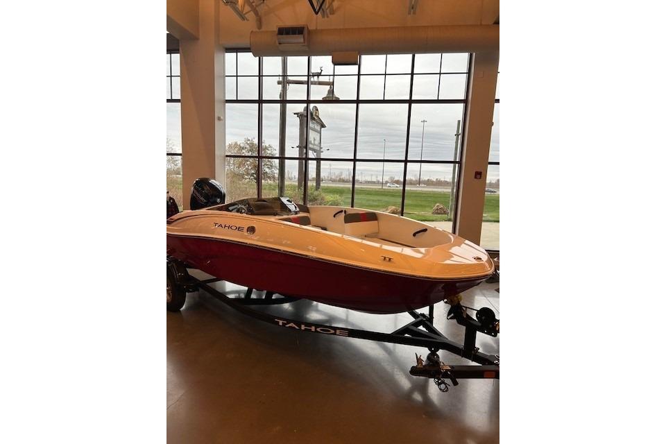 2026 Tahoe T16 boat displayed indoors with large windows in the background.