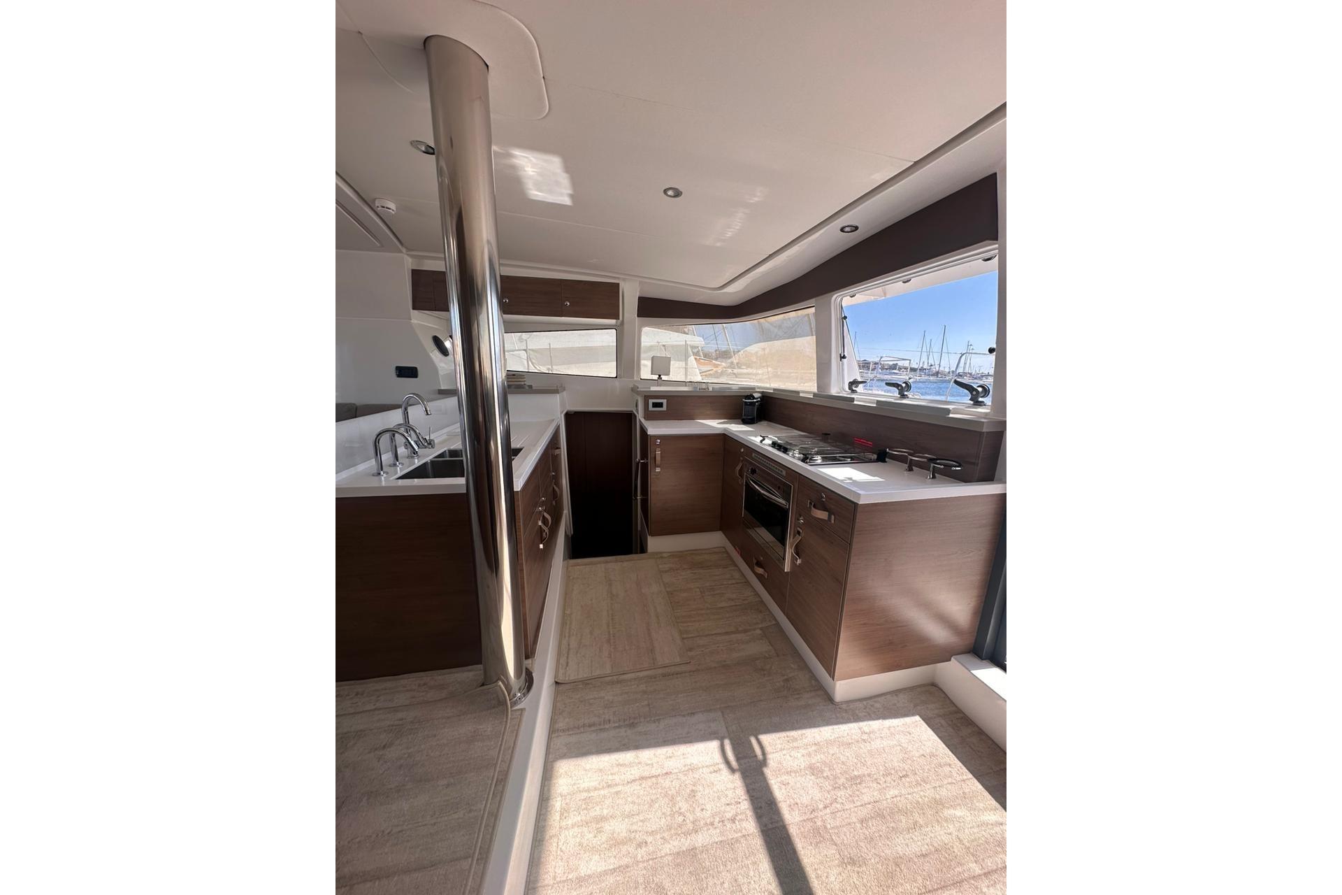 Modern kitchen interior of 2023 Bali 4.2 yacht with sleek design and ocean view.