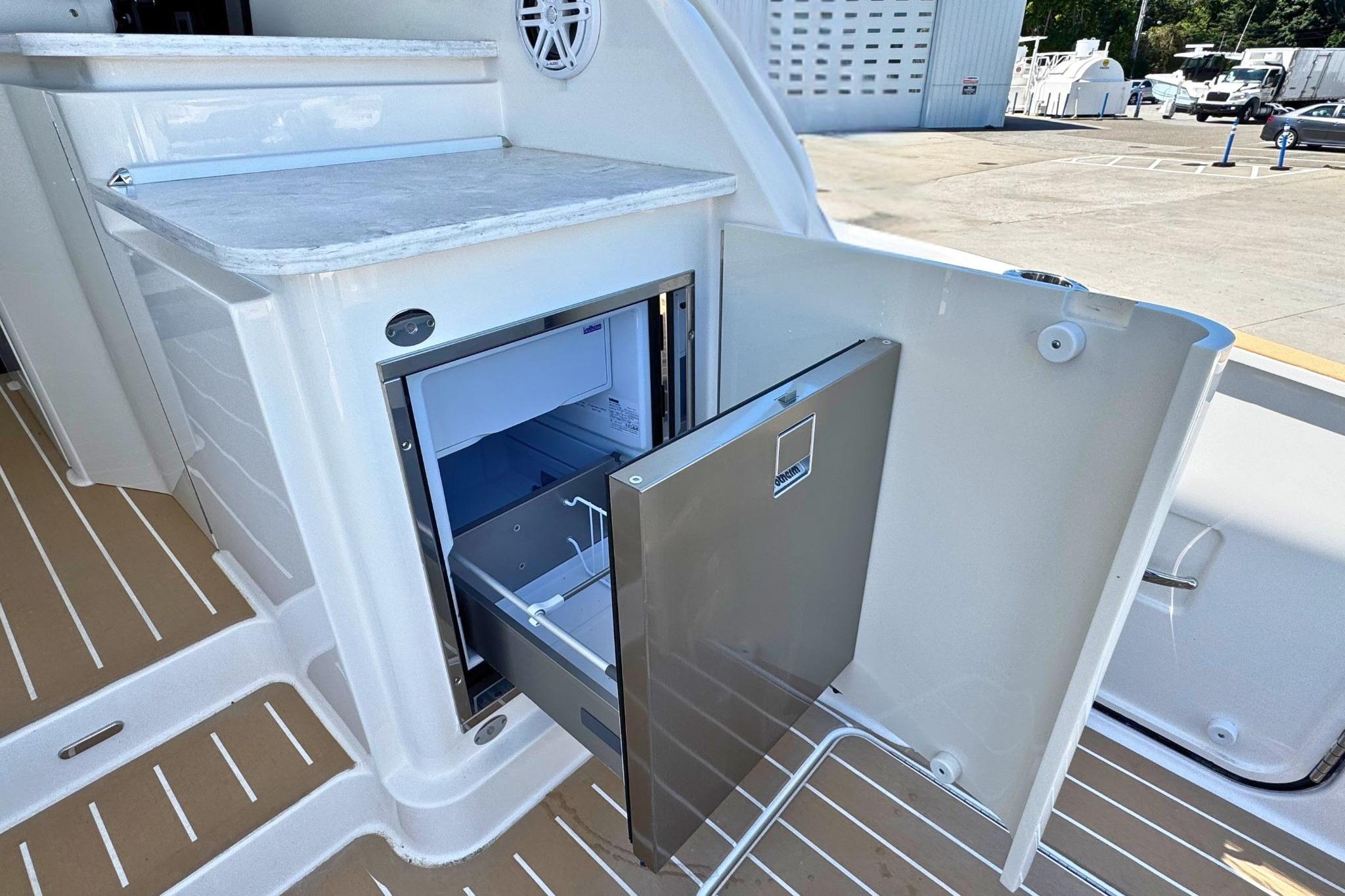 Open drawer refrigerator on 2027 Tiara Yachts 39 LE boat deck.