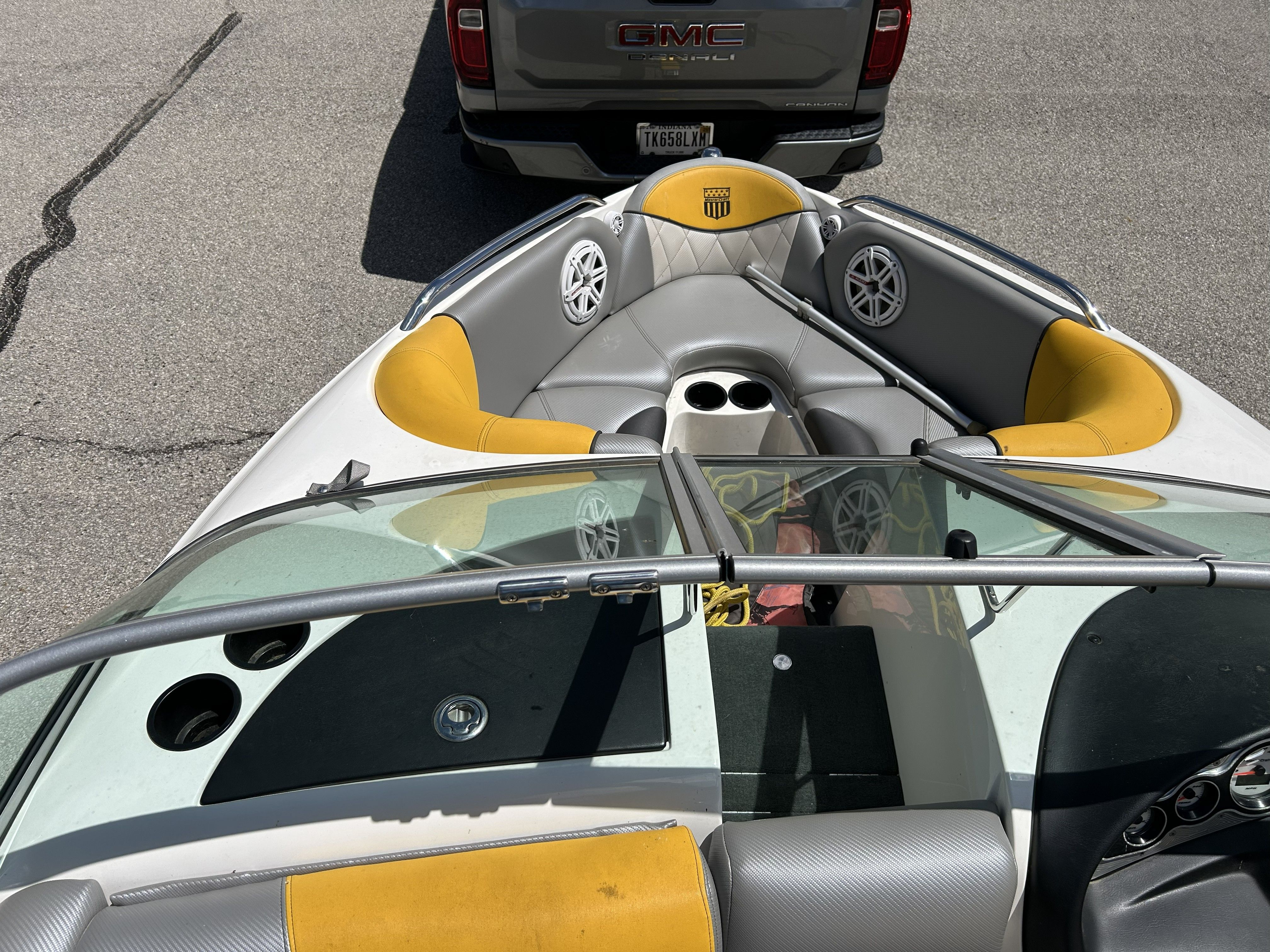 Interior view of a 2011 MasterCraft PS197 boat with yellow and gray seats.