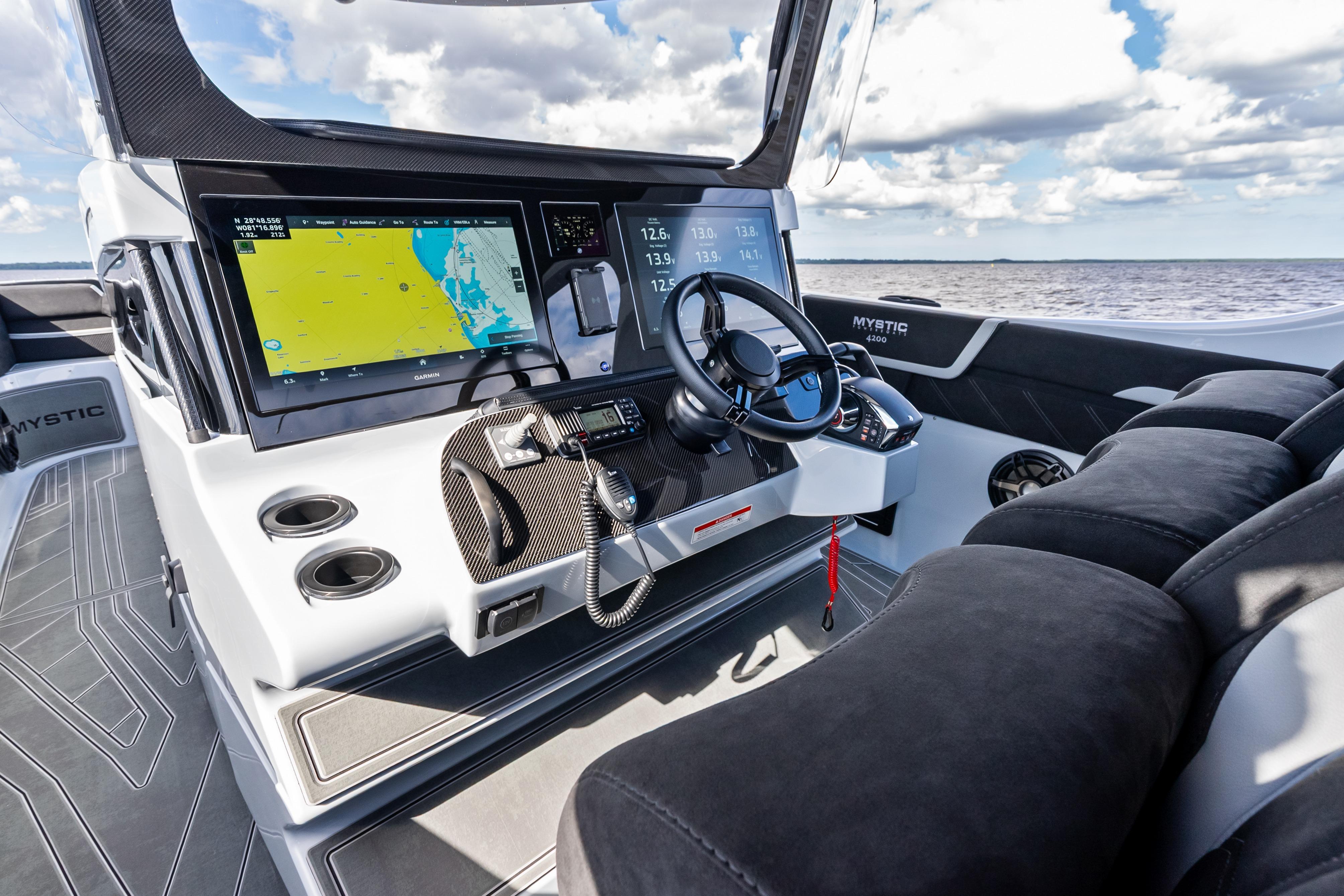 Cockpit of 2027 Mystic Powerboats M4200 with advanced navigation system and luxurious seating.